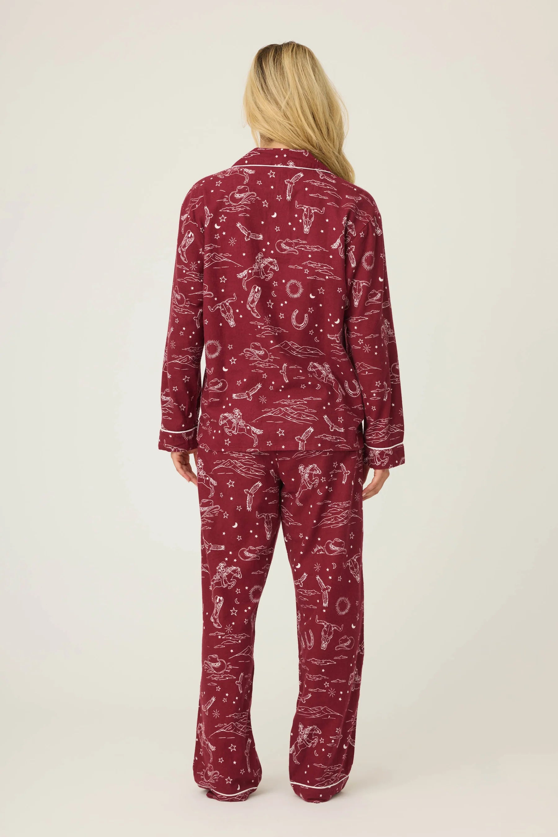 Rear view of a woman wearing the Hold Your Horses Western Flannel 3-Piece PJ Set in burgundy by PJ Salvage.