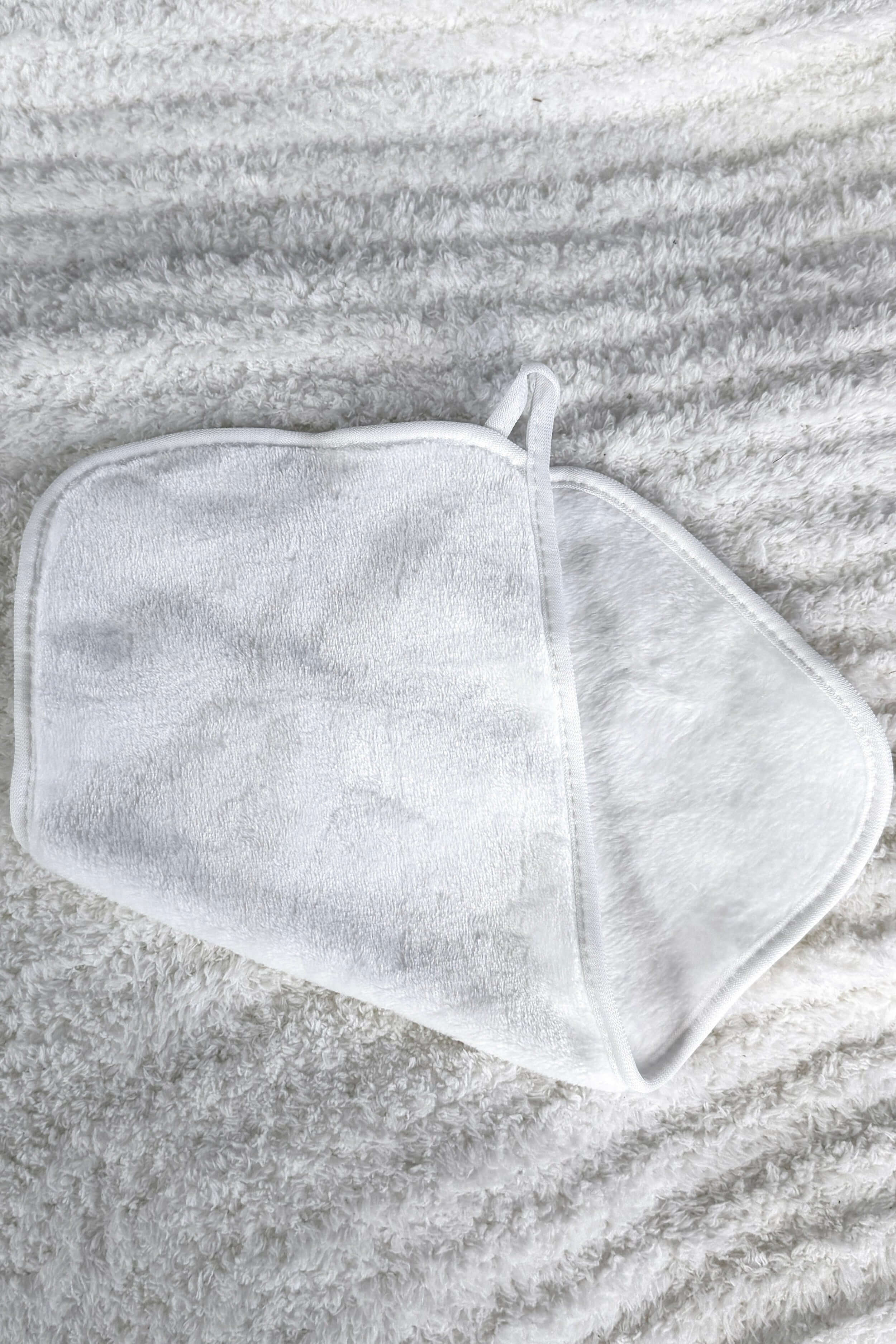 white remove it cloth showing texture of cloth on both sides