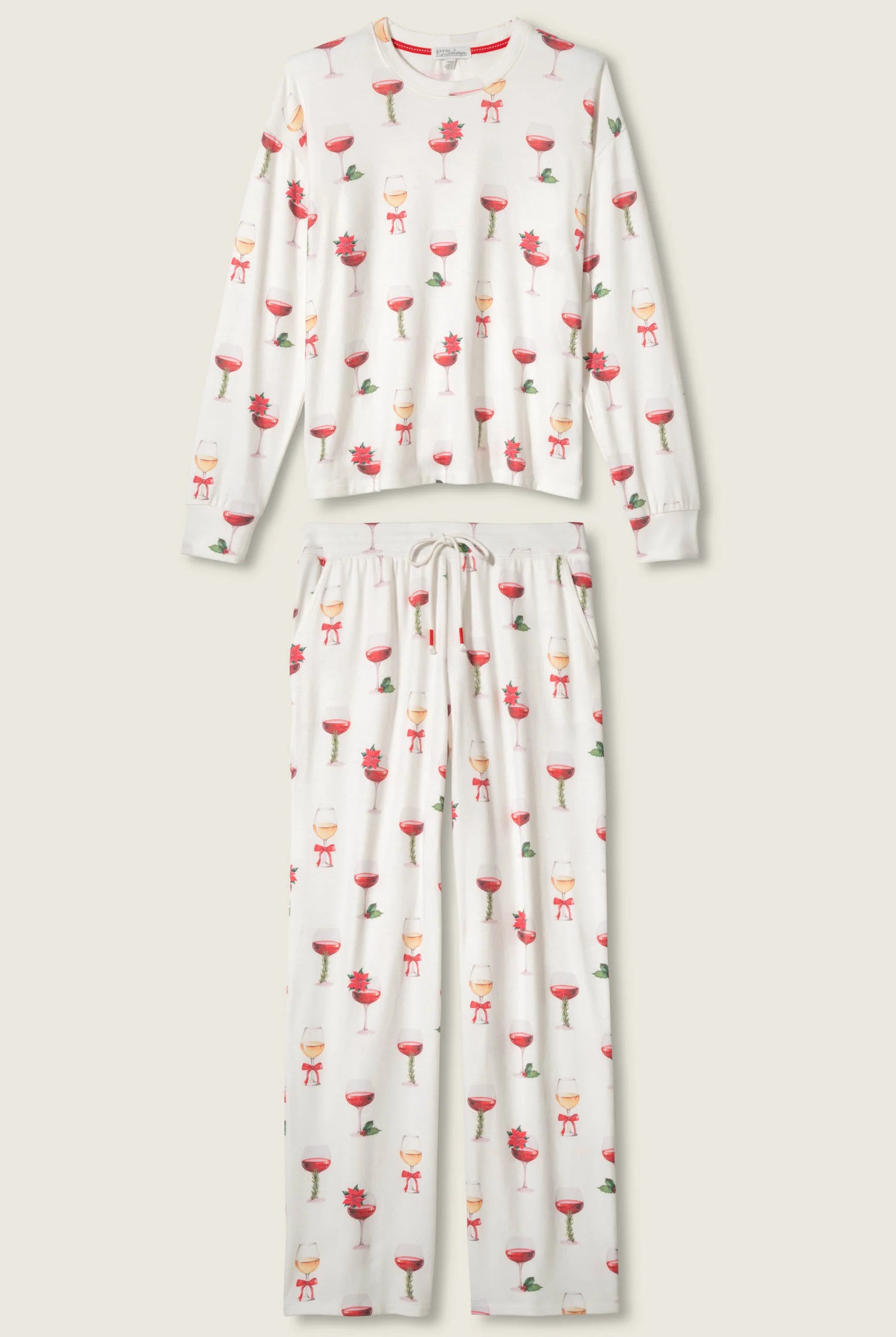 Let's Get Toasty Holiday Wine Print PJ Set | Champagne | PJ Salvage Women's set with champagne coupes with red liquid and holly, poinsettia and bows on an ivory background