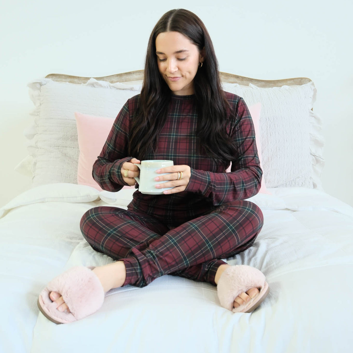Georgia Rylan Bamboo Plaid PJ Set model seated on bed with mug lifestyle — Cloud Nine Pajamas Edmonton