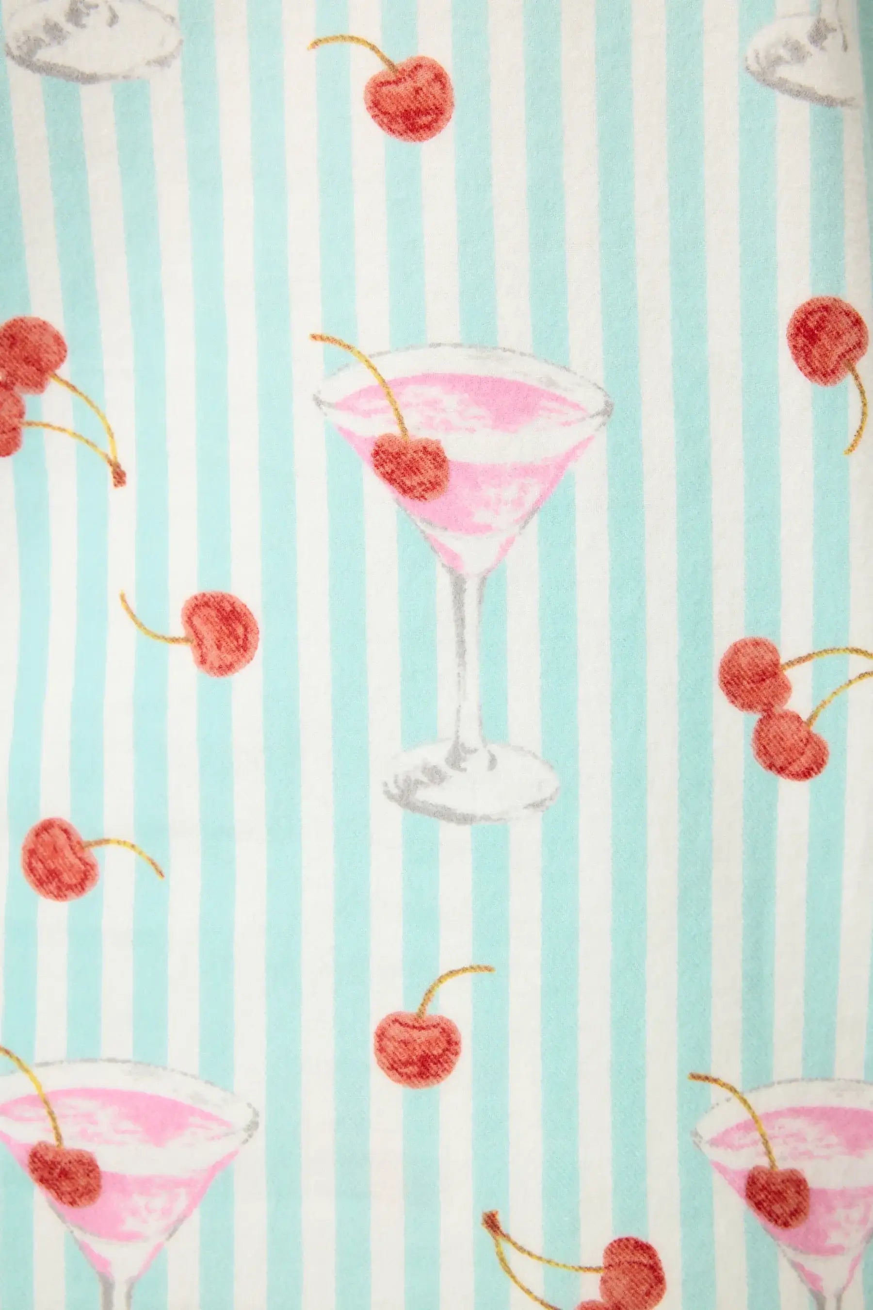 Ma Cherie Cherry Print featuring cocktails and cherries on a blue striped background.