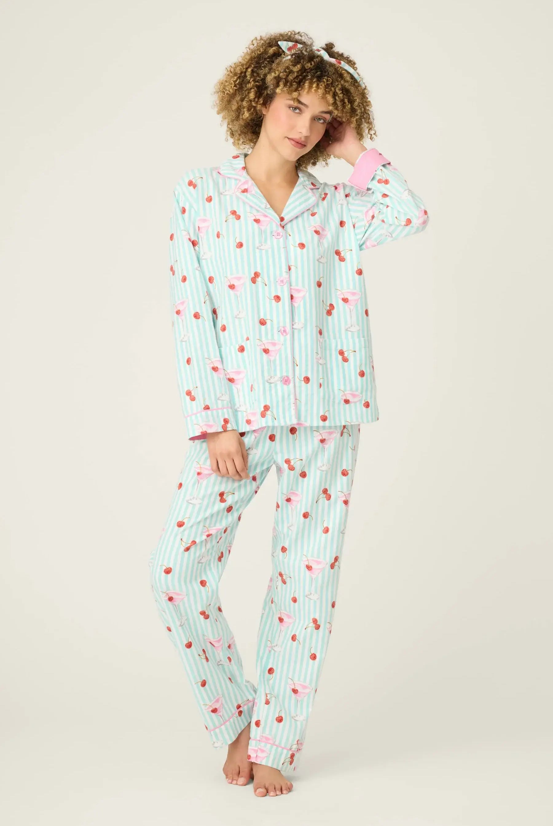 Model wearing Ma Cherie Cherry Print 3-Piece Flannel PJ Set from PJ Salvage in light blue with cherry pattern.