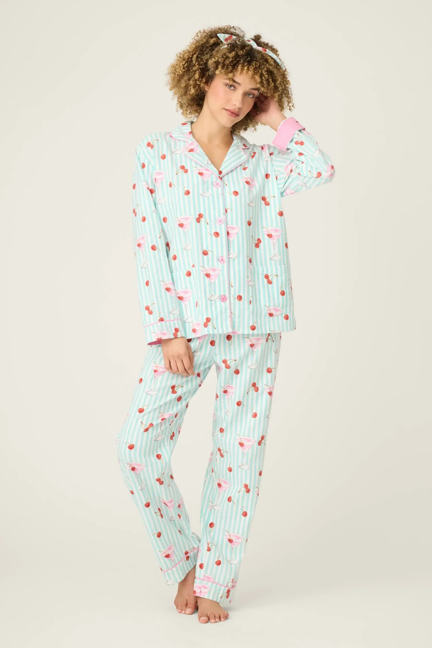 Model wearing Ma Cherie Cherry Print 3-Piece Flannel PJ Set from PJ Salvage in light blue with cherry pattern.