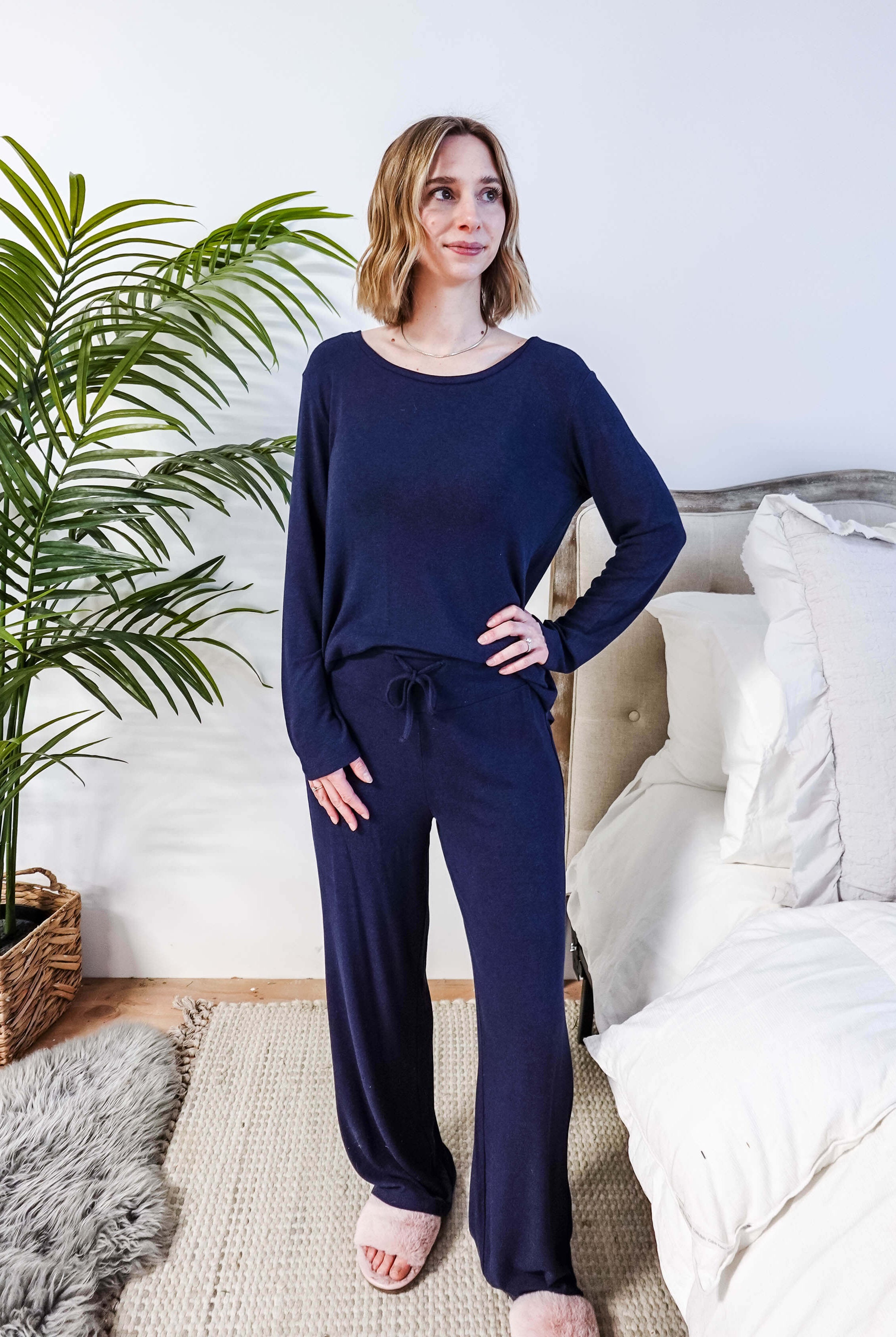 Miranda wearing the Navy Melange Top Straight Pant Knit Lounge Set, highlighting the boat-neck top and flowy trousers.