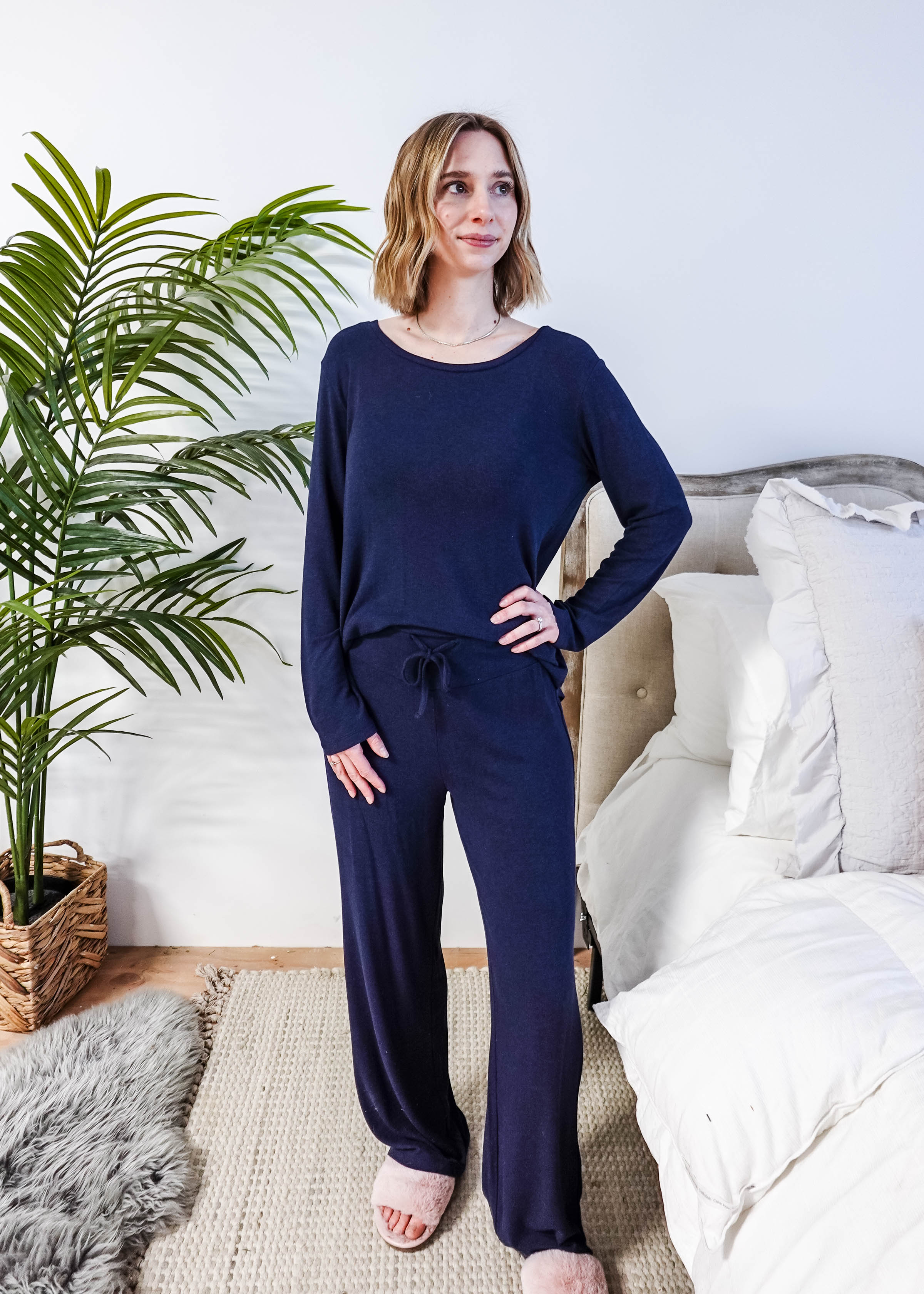 Miranda wearing the Navy Melange Top Straight Pant Knit Lounge Set, highlighting the boat-neck top and flowy trousers.