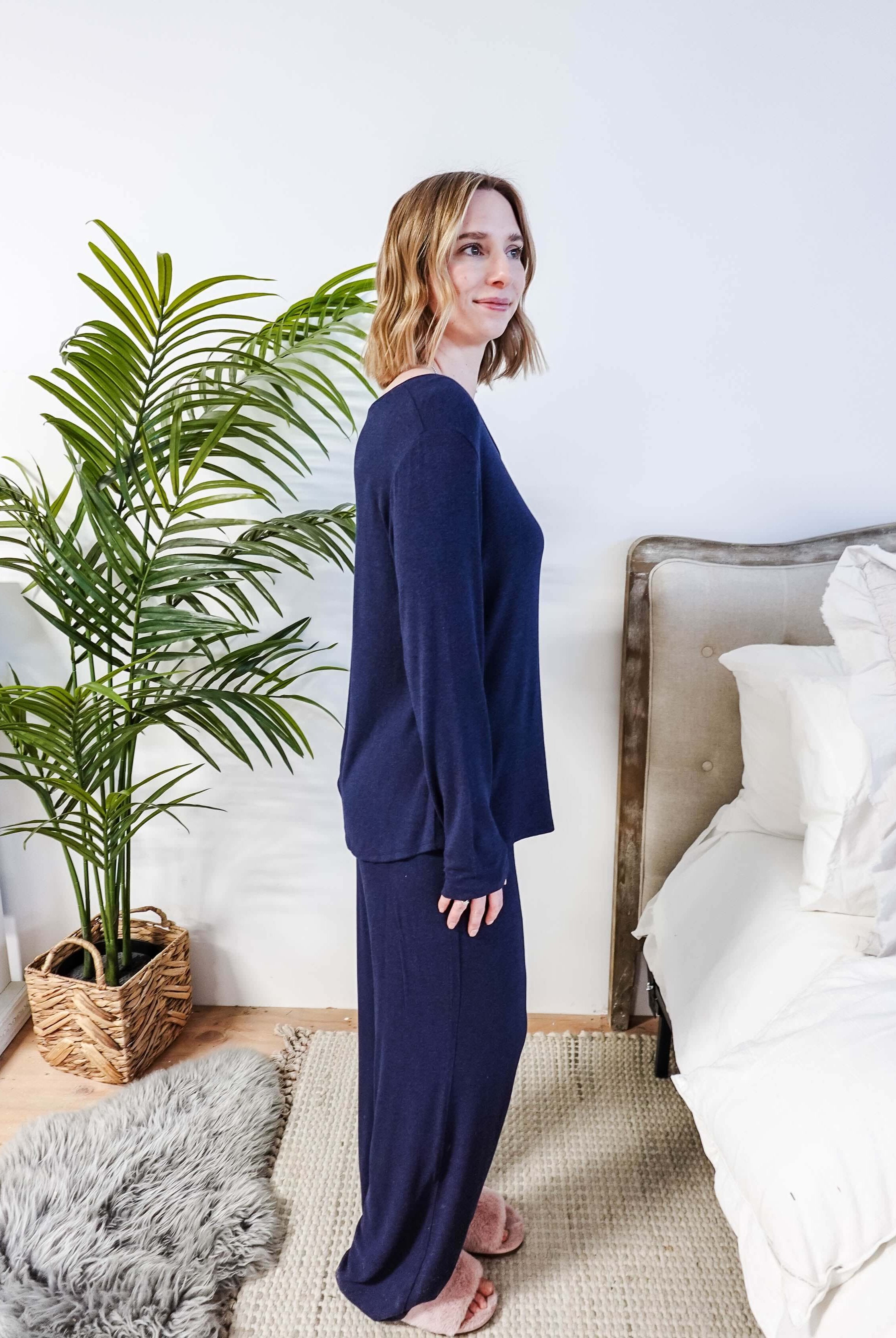 Miranda wearing the Navy Melange Top Straight Pant Knit Lounge Set, highlighting the boat-neck top and flowy trousers.
Side profile shot