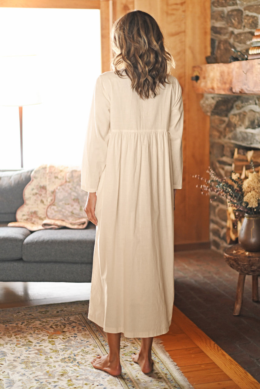 Photo of the back April Cornell Embroidery Sampler Nighty in ecru cotton, showing the long, flowing length and gentle gathers.
