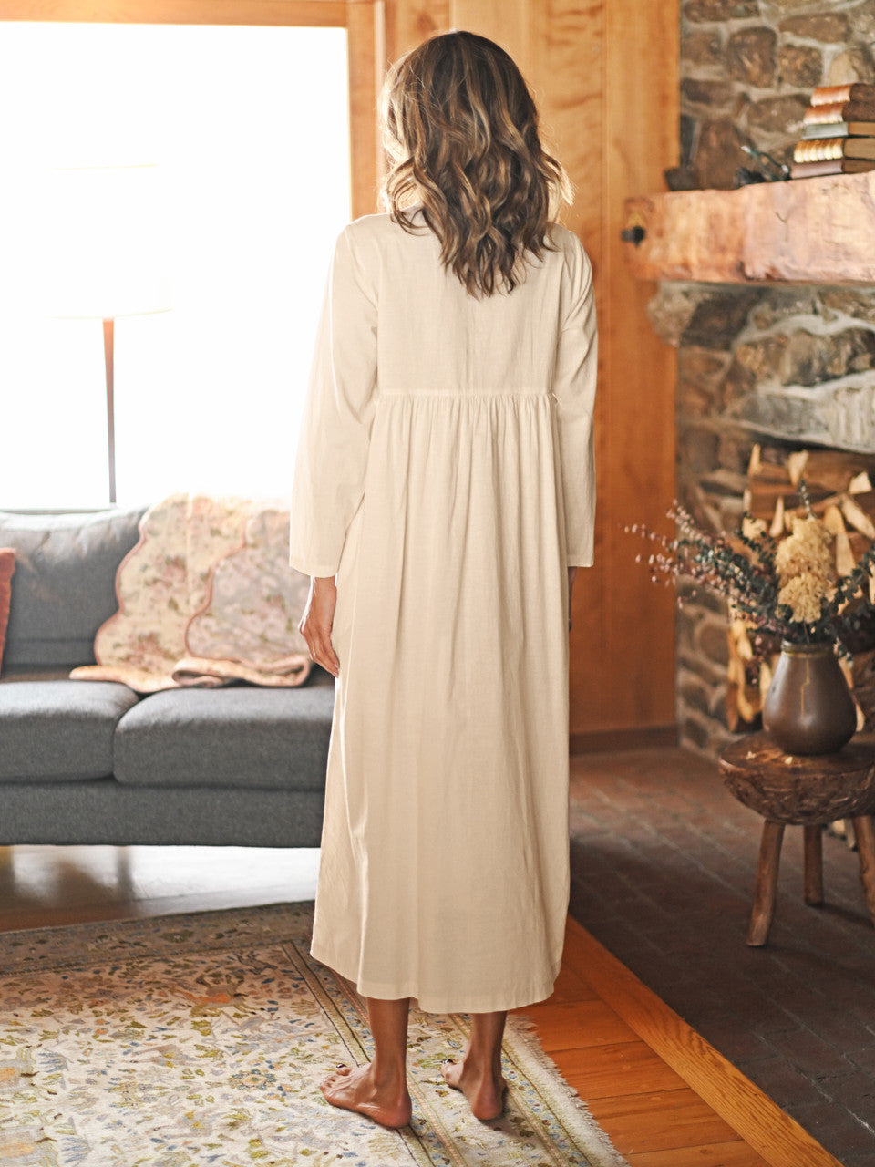 Photo of the back April Cornell Embroidery Sampler Nighty in ecru cotton, showing the long, flowing length and gentle gathers.