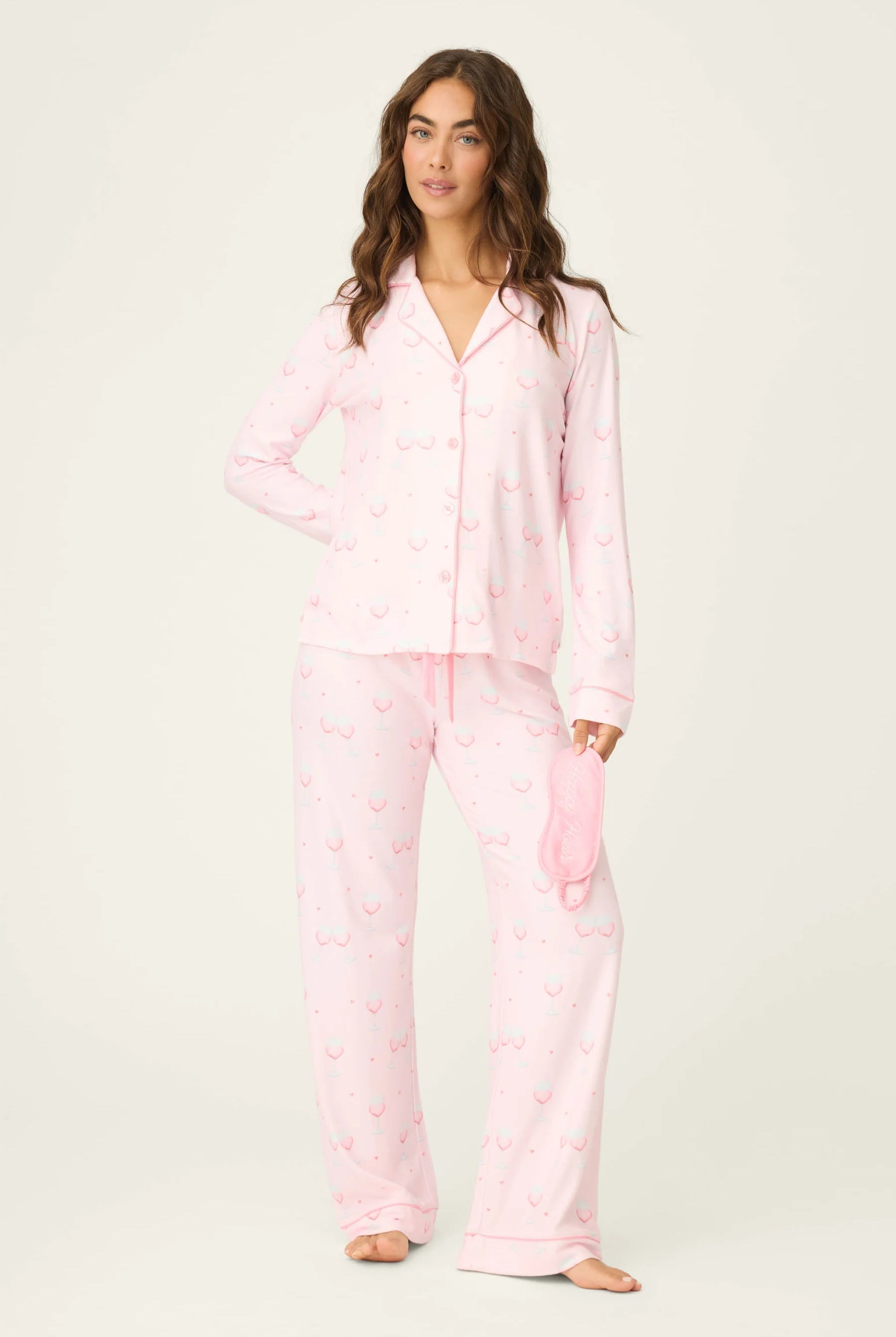 Happy Hour Wine Glass Print 3-Piece PJ Set | PJ Salvage women's wine glass print pj set in pink - button up long sleeve top, straight leg pants, and matching eye mask showing full length on model