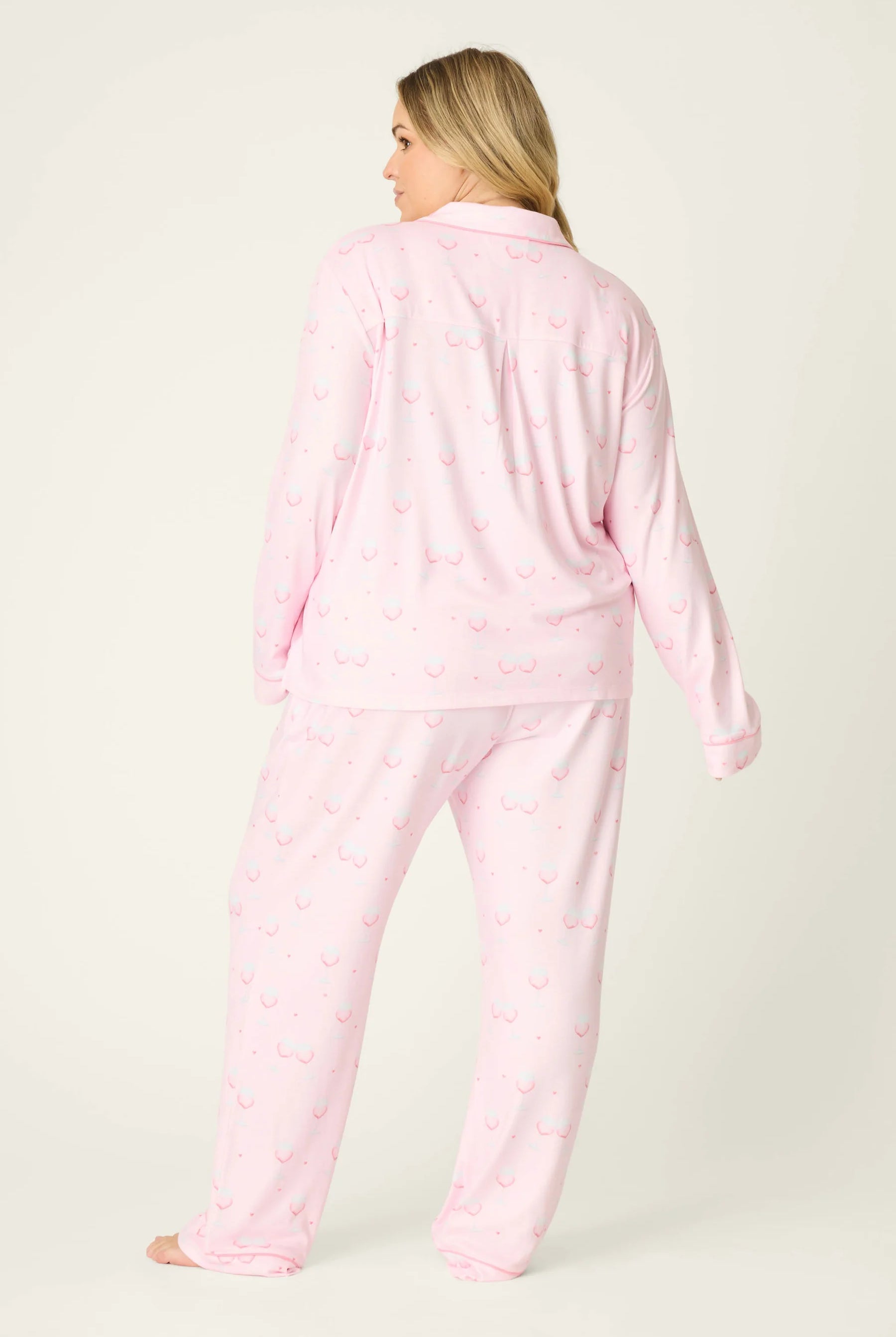 Happy Hour Wine Glass Print 3-Piece PJ Set Plus Size Inclusive model wearing playful pink pajama set with wine glass pattern, back view.