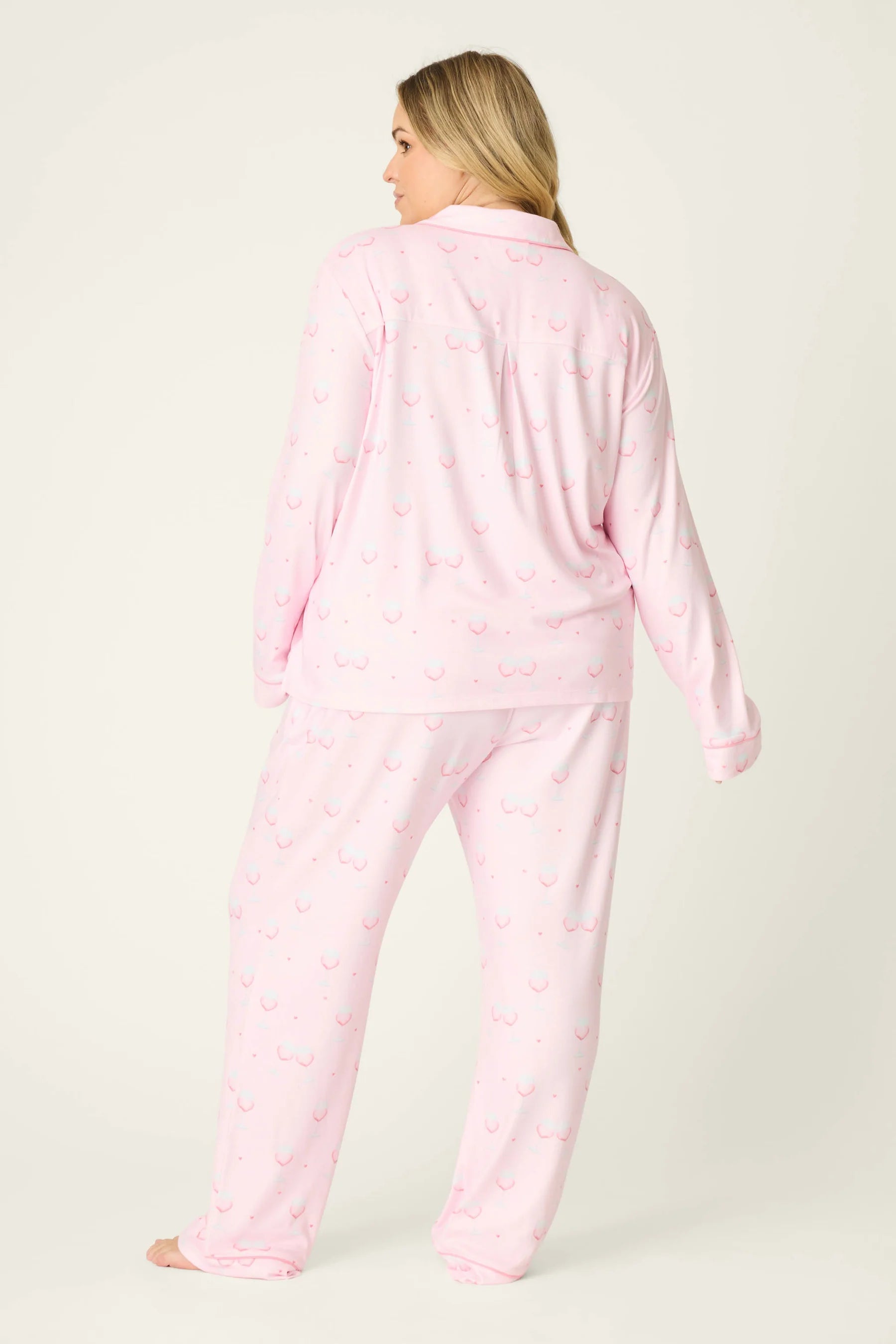 Happy Hour Wine Glass Print 3-Piece PJ Set Plus Size Inclusive model wearing playful pink pajama set with wine glass pattern, back view.