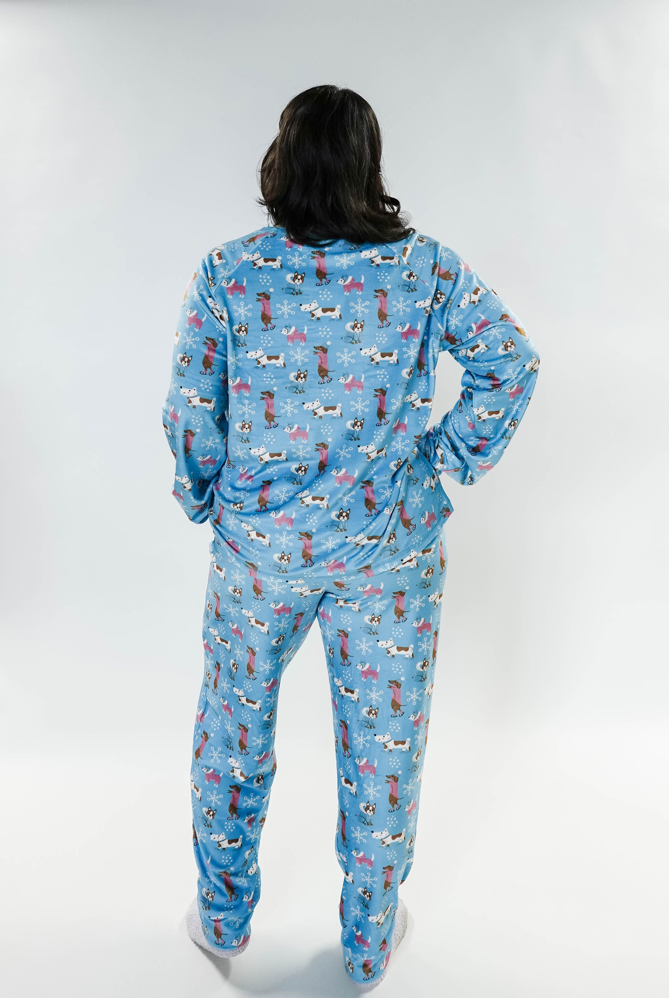 Back view of a model wearing the Paws On Ice Long Sleeve Jogger Velour Lounge Set by Miranda Nic.