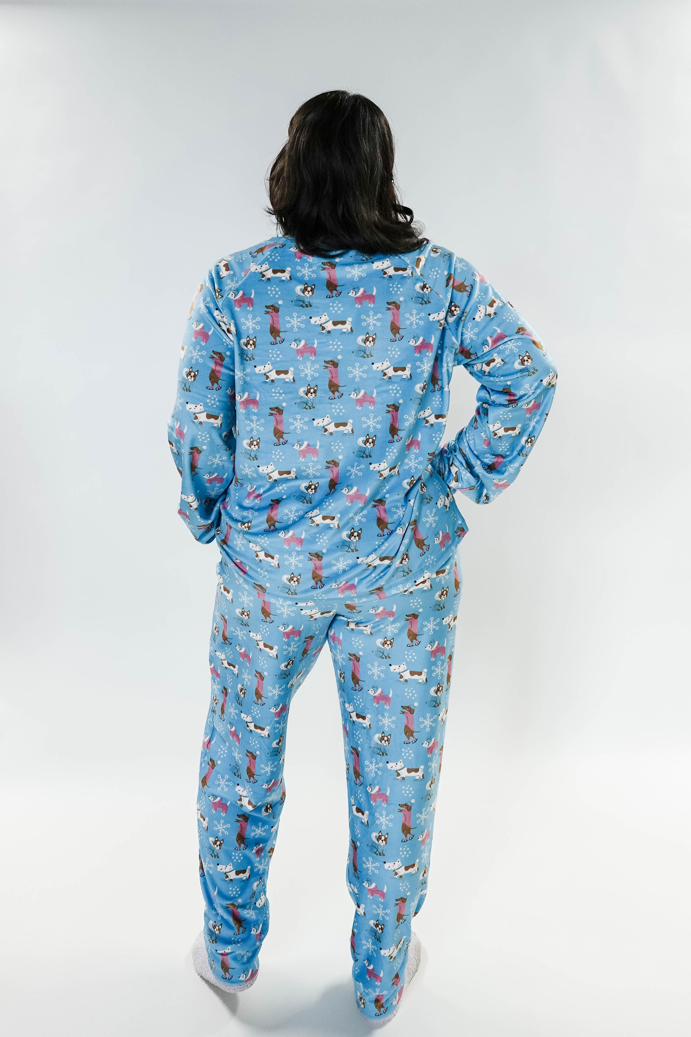 Back view of a model wearing the Paws On Ice Long Sleeve Jogger Velour Lounge Set by Miranda Nic.