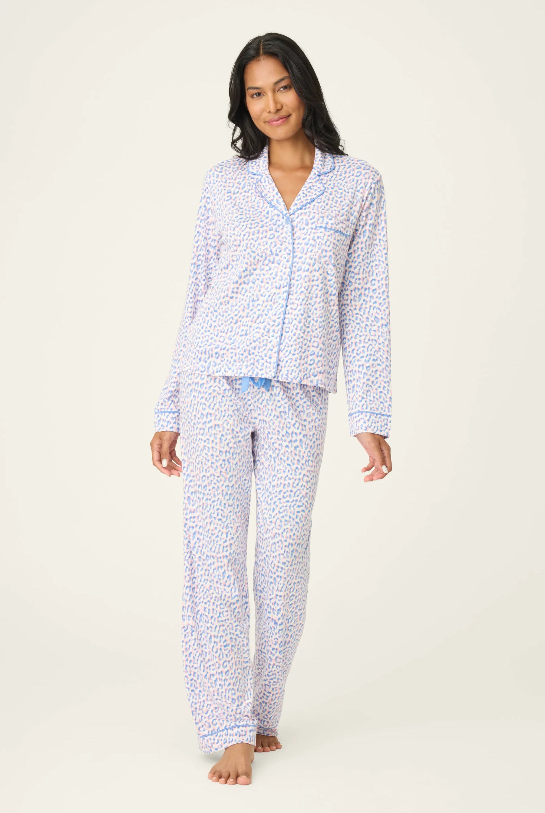 Model wearing Whimsy Walk On The Wild Side PJ Set, featuring leopard print in sky-blue and soft-coral colors.