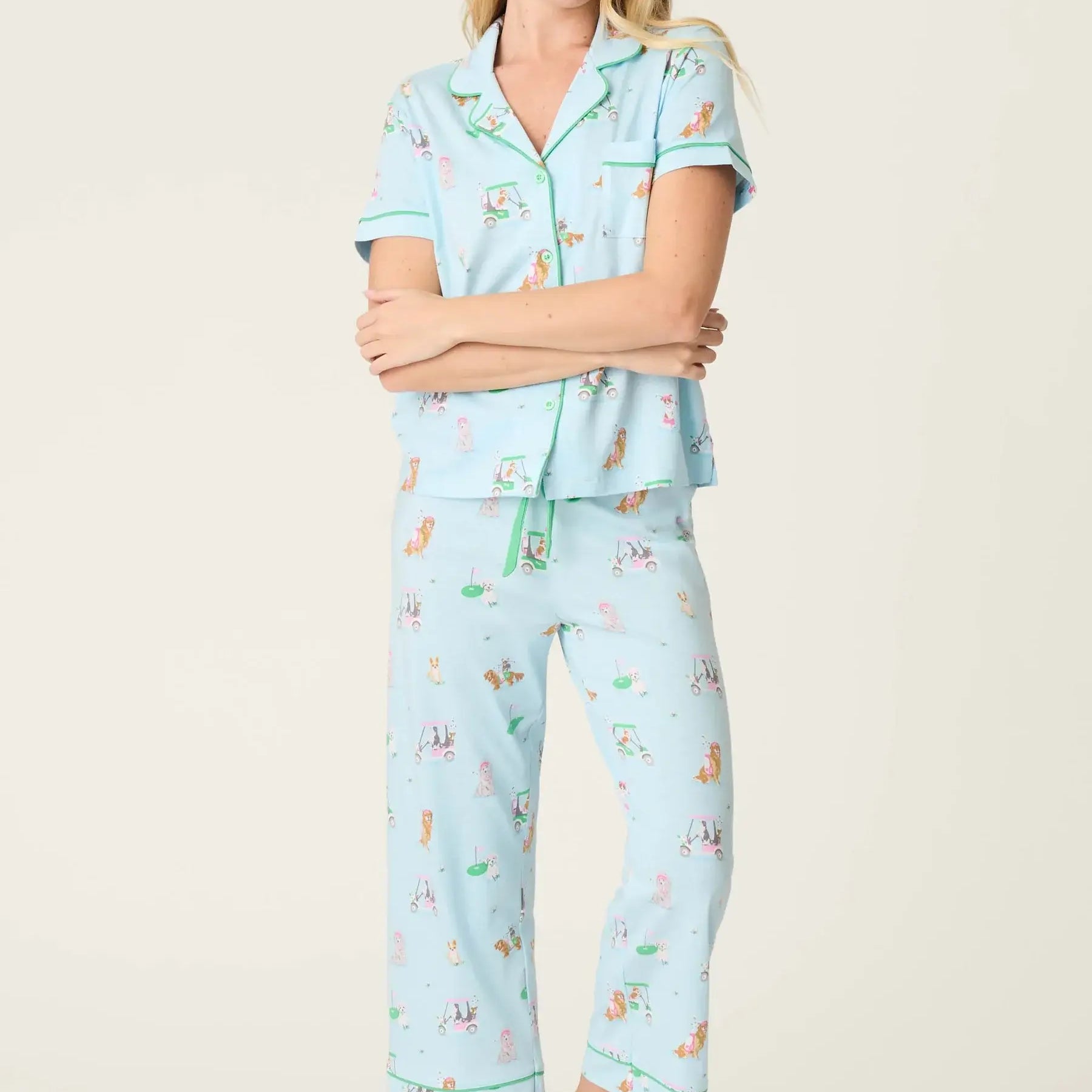 PJ SALVAGE Whimsy Cropped PJ Set in Light Blue Putter Pup print showing dogs golfing. Model stands wearing the set against a light background