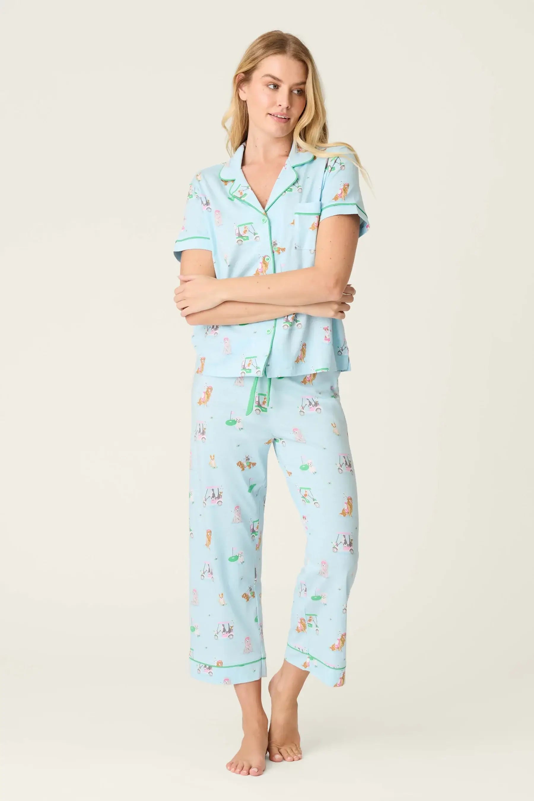 PJ SALVAGE Whimsy Cropped PJ Set in Light Blue Putter Pup print showing dogs golfing. Model stands wearing the set against a light background