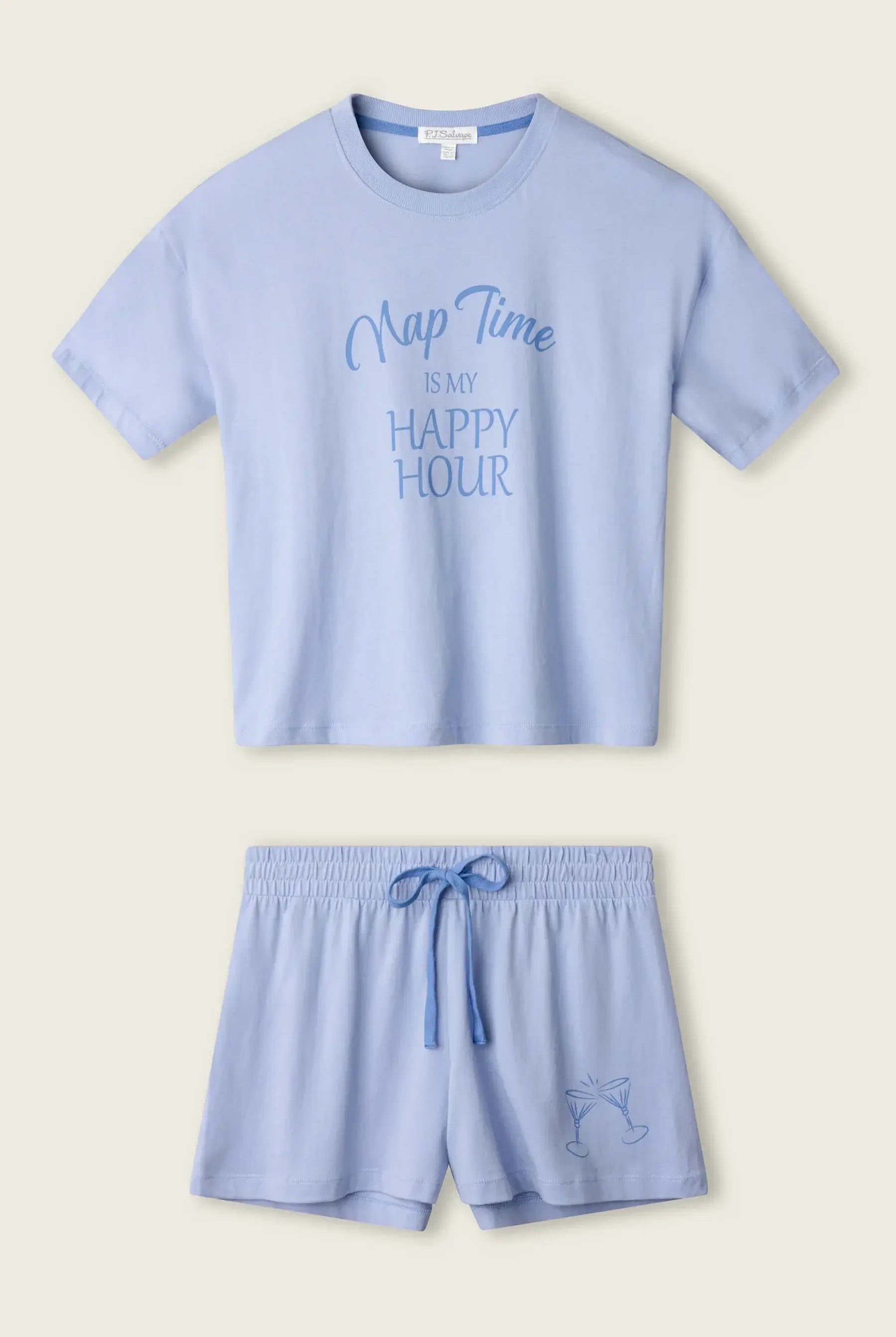 PJ SALVAGE Graphic Print Softee Tee & Short Lounge Set in "Nap Time is my Happy Hour" graphic tee shirt in light blue. Product lay flat on a light background shot
