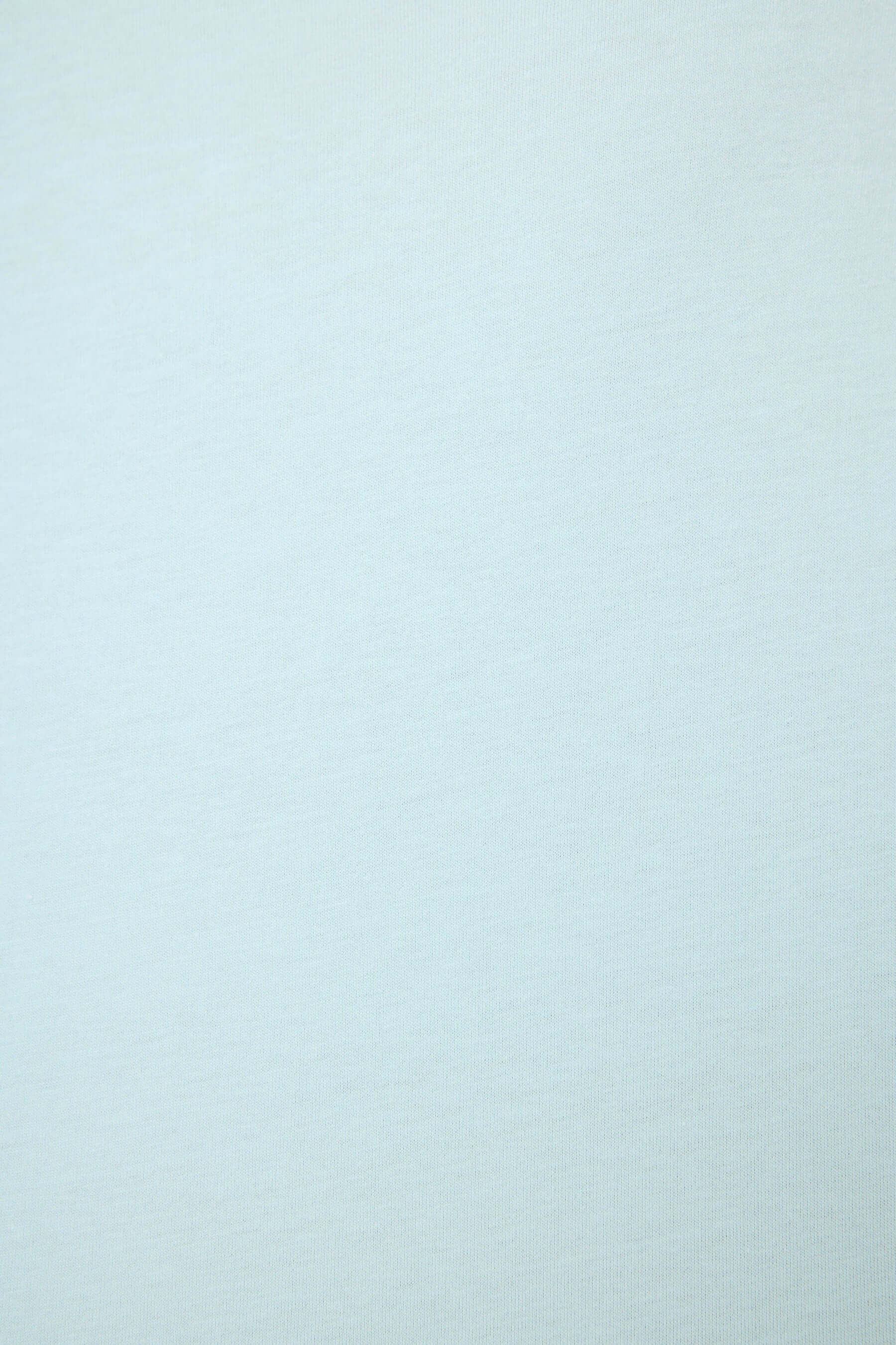 PJ SALVAGE Graphic Print Softee Tee & Short Lounge Set in "Breakfast Club" graphic tee shirt in light blue. Fabric close up of the cotton slub showing the texture and colour of the set