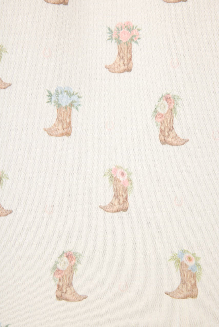 Western Blooms Boot Bouquet pattern featuring floral cowboy boots on an ivory background.