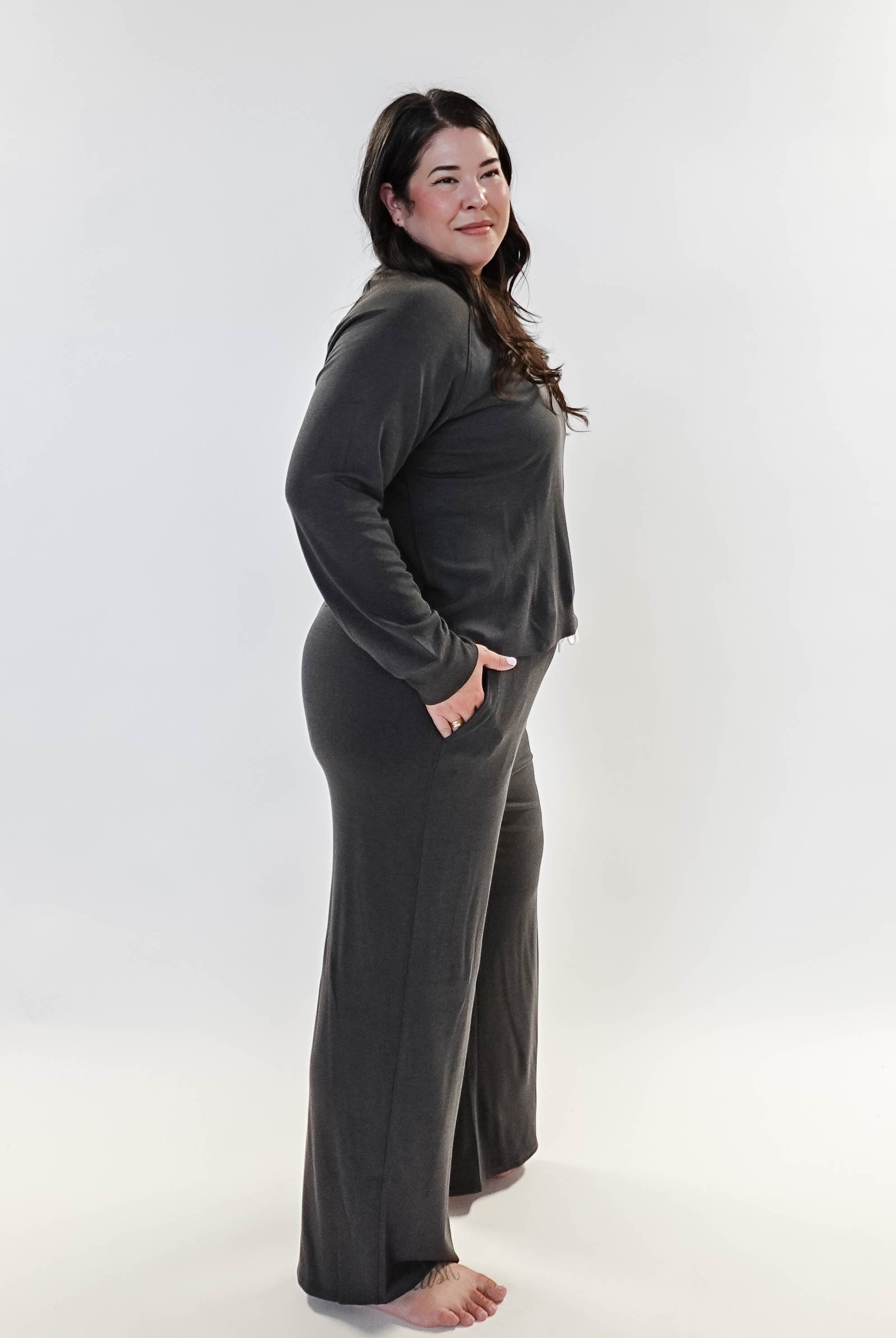 Long Sleeve Raw Edge Straight Pant Lounge Set modeled by a woman in a gray outfit, showcasing comfort and style.