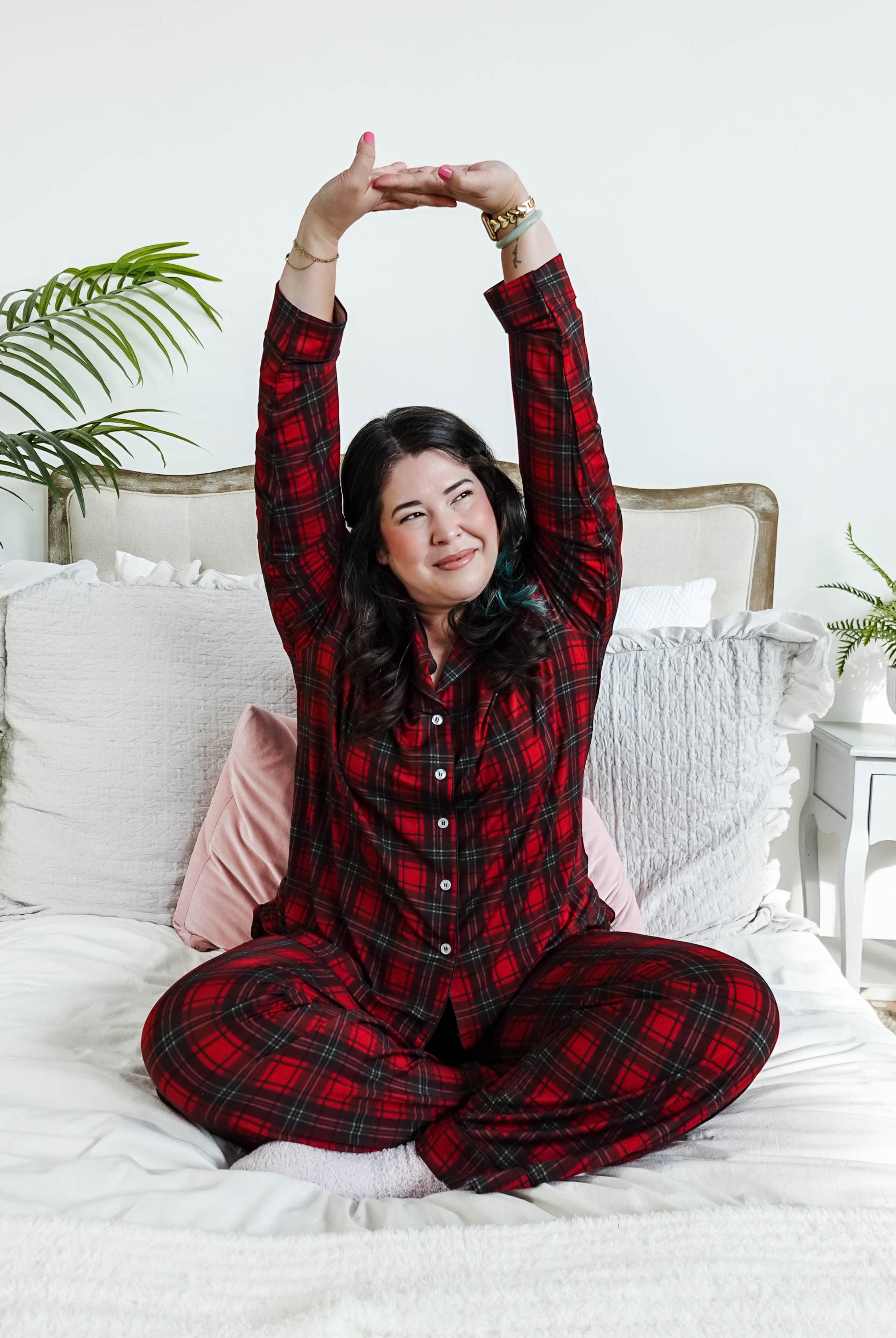 woman stretching on bed wearing Red Plaid Button Up Bamboo PJ Set Straight Leg Pant