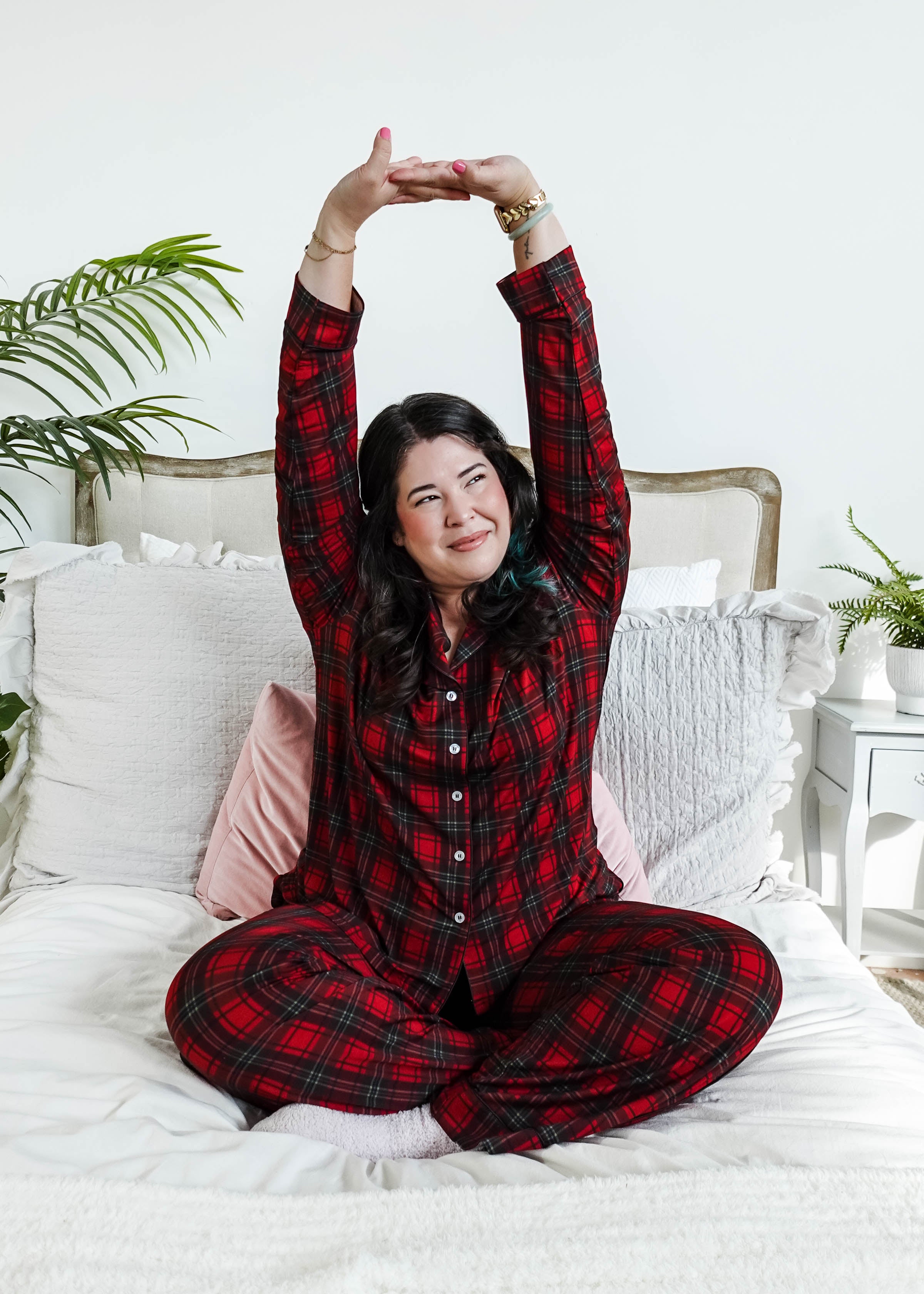 woman stretching on bed wearing Red Plaid Button Up Bamboo PJ Set Straight Leg Pant