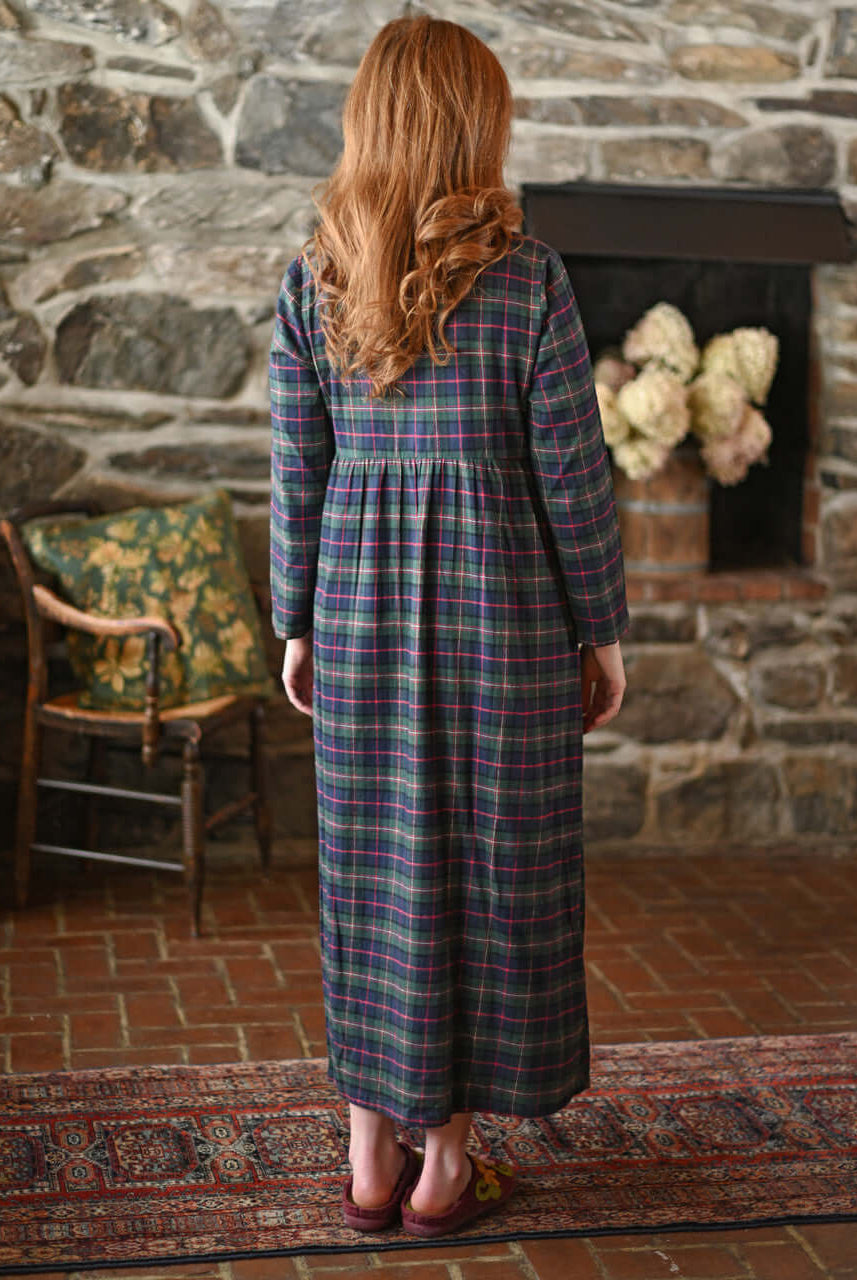 Back view of a woman wearing the Saratoga Long Flannel Cotton Nightgown in blue plaid from April Cornell.