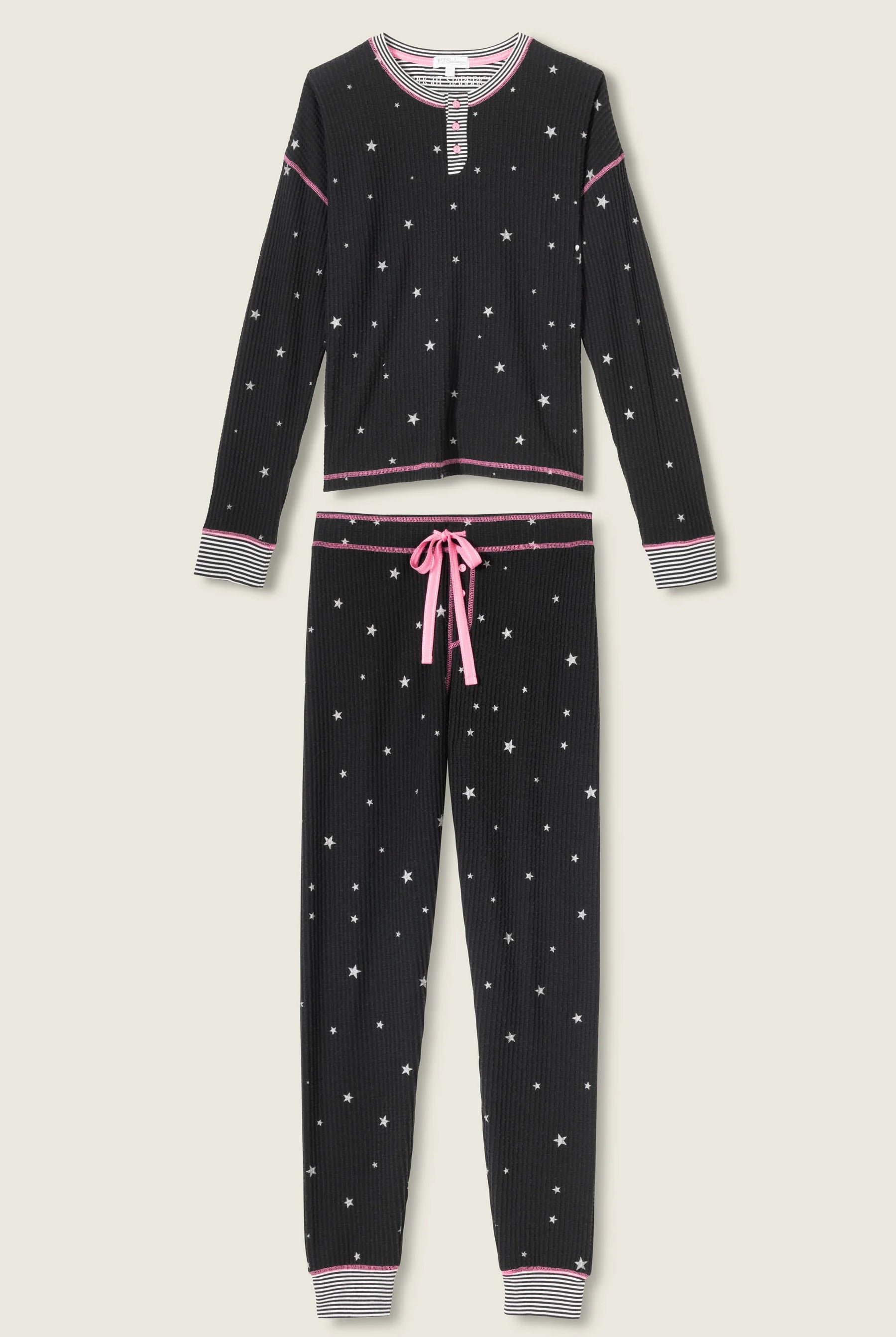 Woman wearing Ski Jammie Classics Brushed Thermal PJ Set, featuring playful winter prints in black starlight starbright star print
