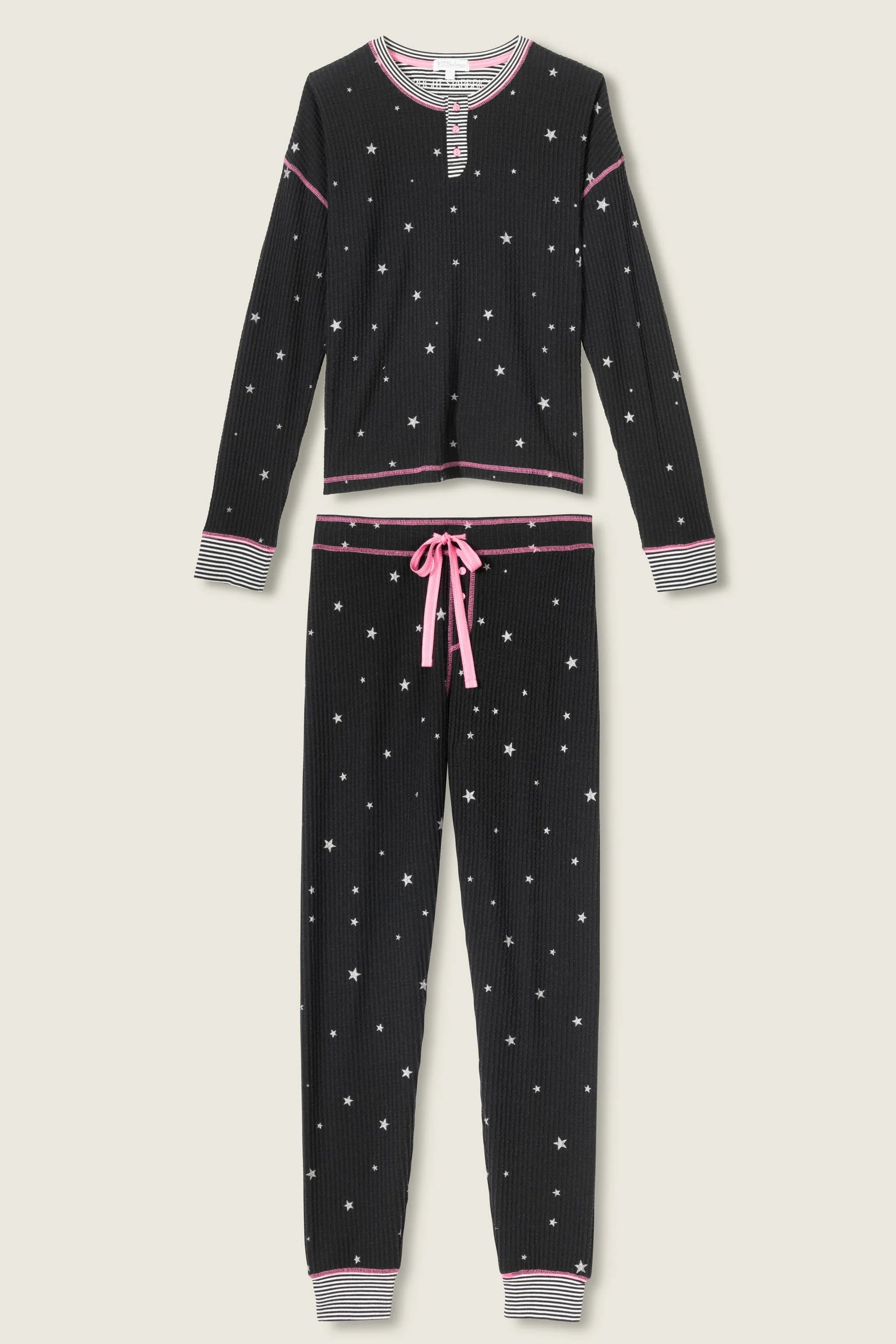 Woman wearing Ski Jammie Classics Brushed Thermal PJ Set, featuring playful winter prints in black starlight starbright star print