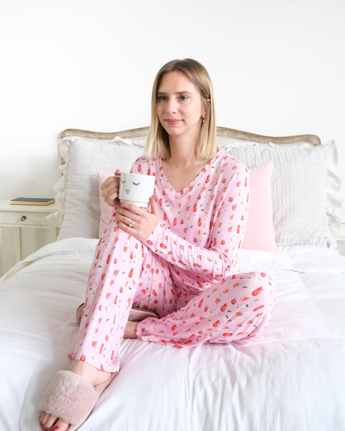 Georgia Rylan Cozy Cocktails V-Neck Bamboo PJ Set lifestyle front view seated on bed — Cloud Nine Pajamas Edmonton