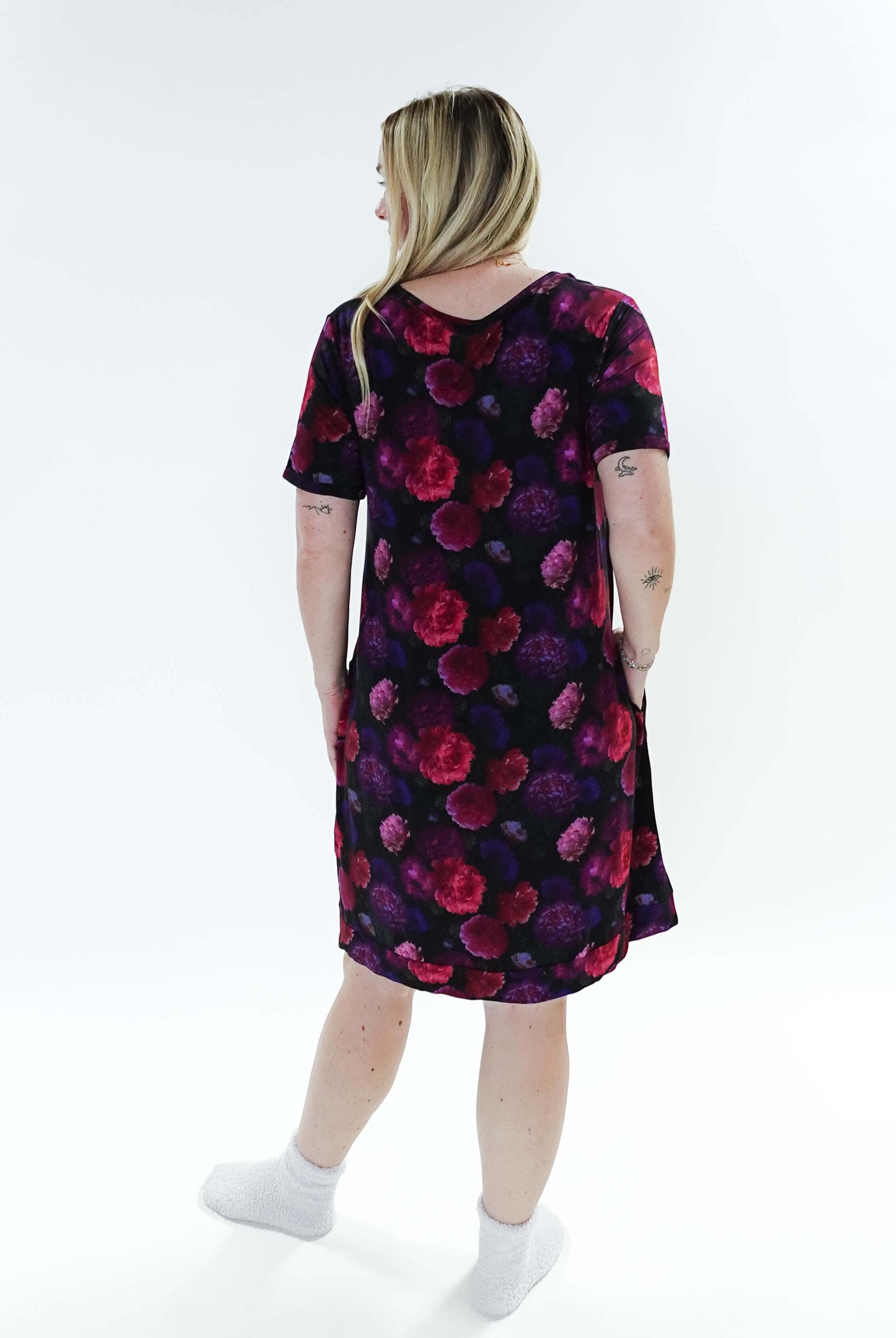 Model wearing the Winter Blossom V Neck Bamboo Nightshirt with Pockets, showing back. Features colorful floral print.