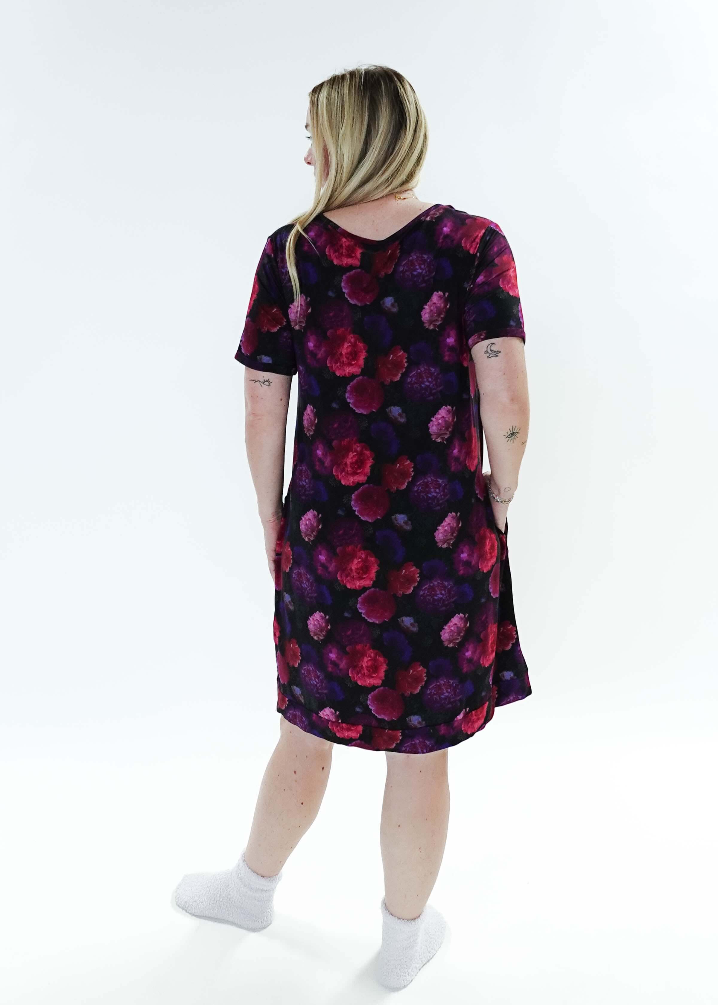 Model wearing the Winter Blossom V Neck Bamboo Nightshirt with Pockets, showing back. Features colorful floral print.