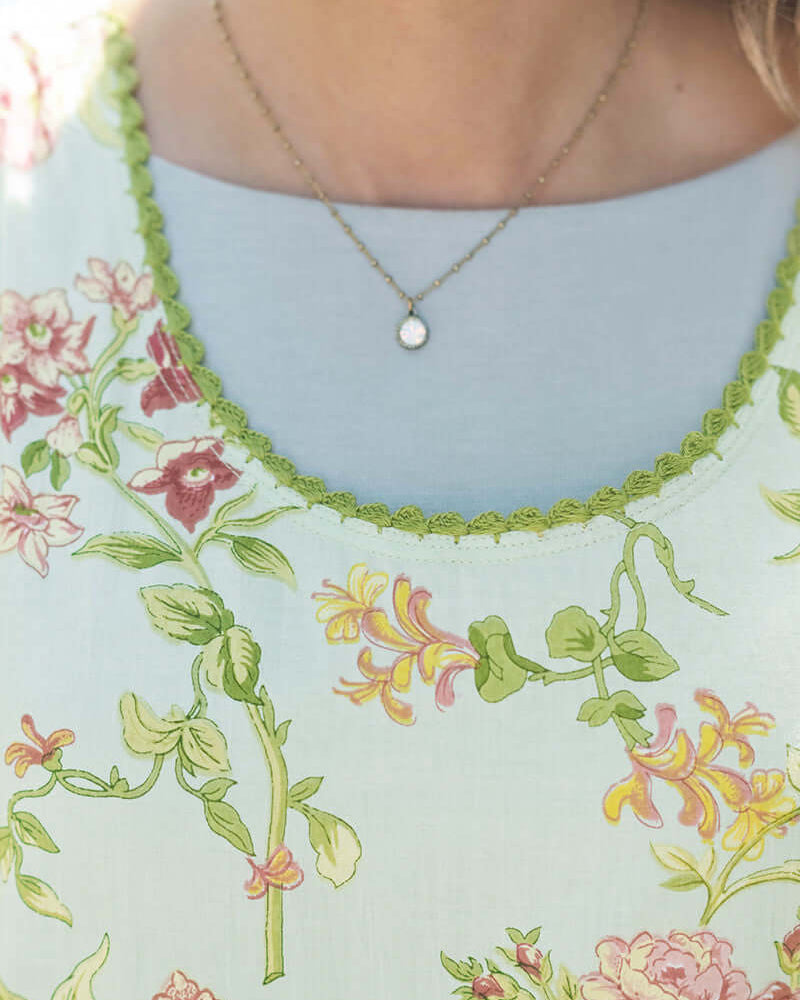 April Cornell Milene Cotton Pinafore Midi Dress Sage Green with Hand-Crochet Neckline showing close up of the neckline