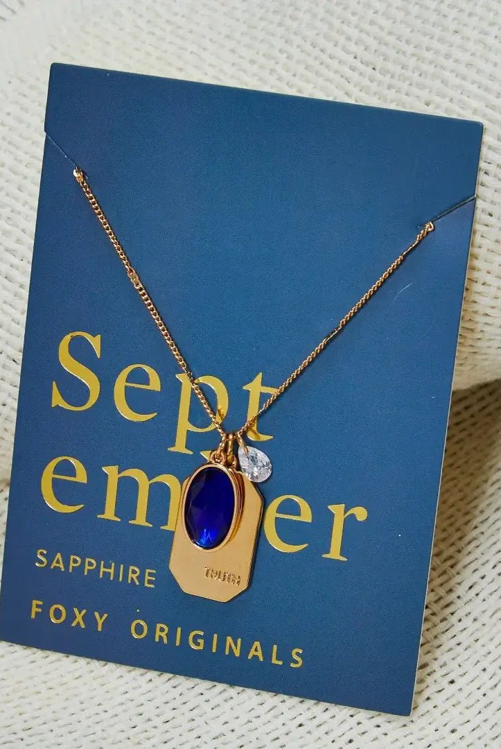 Birthstone Charm Necklace in 14k Plated Gold featuring September sapphire stone and 'TRUTH' charm by Foxy Originals.