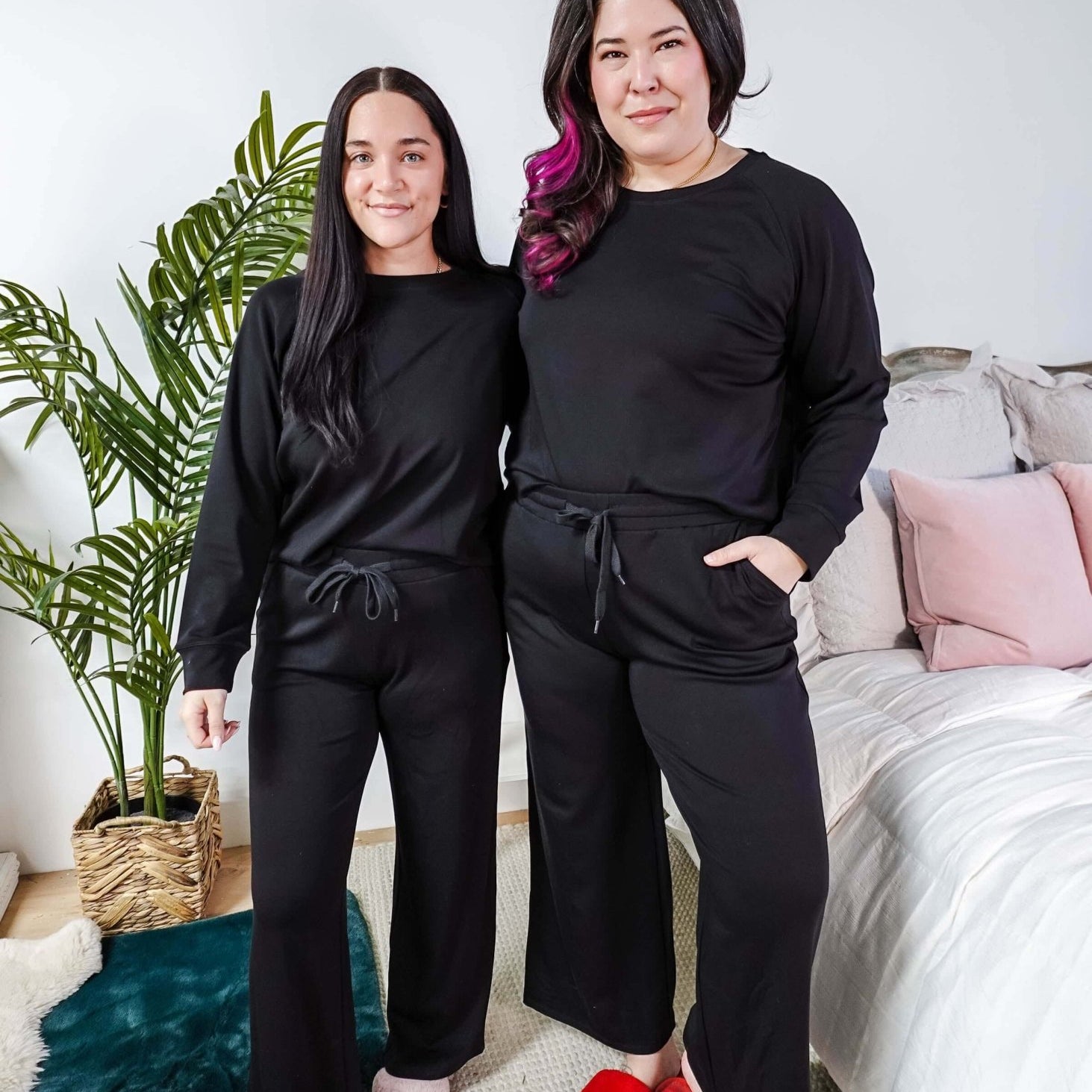 Black Long Sleeve Raw Edge Straight Pant Cloud Lounge Set worn by two women in a stylish home setting.