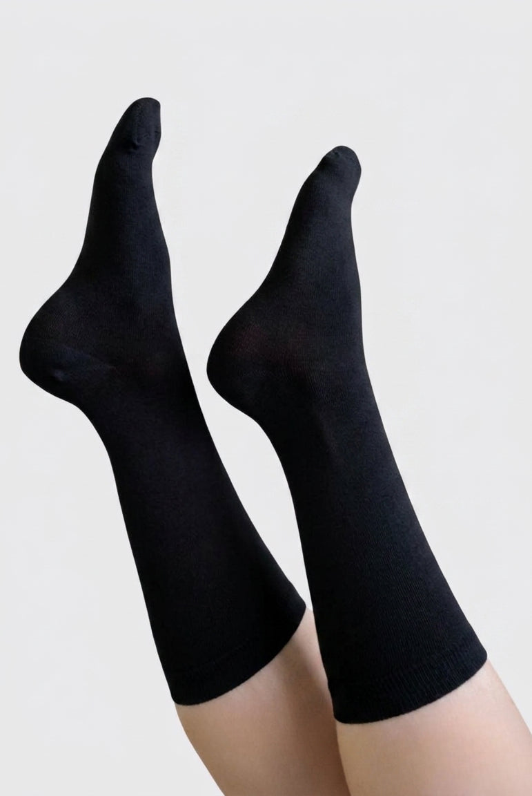Georgia Rylan black bamboo crew sock on model full length — Cloud Nine Pajamas