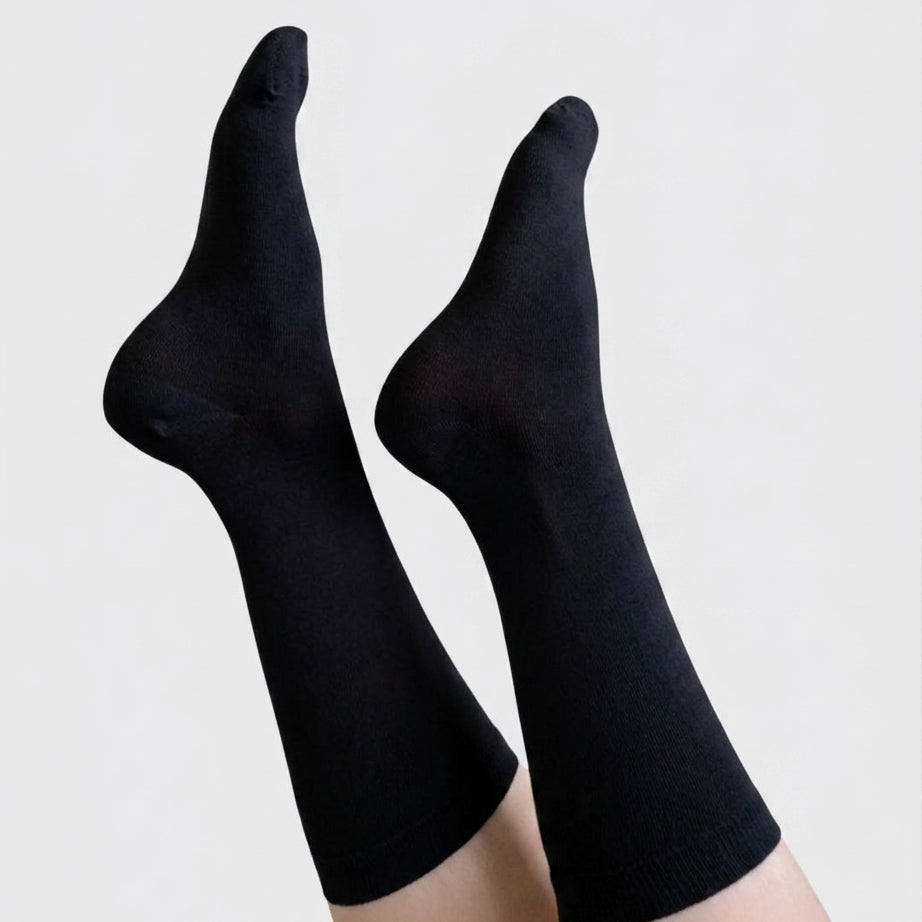 Georgia Rylan black bamboo crew sock on model full length — Cloud Nine Pajamas
