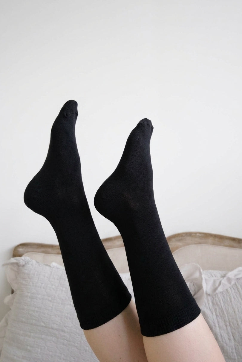 Georgia Rylan black bamboo crew sock lifestyle on model — Cloud Nine Pajamas