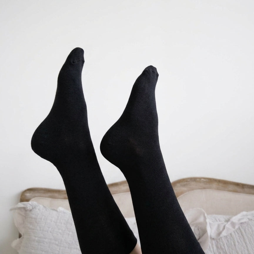Georgia Rylan black bamboo crew sock lifestyle on model — Cloud Nine Pajamas