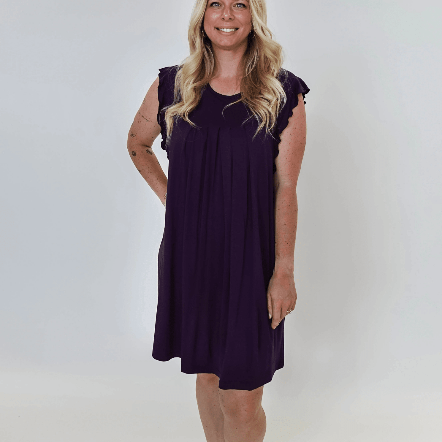 Model wearing Blackberry Amethyst Flutter Bamboo Nightgown in purple, showcasing its elegant design and comfortable fit.
