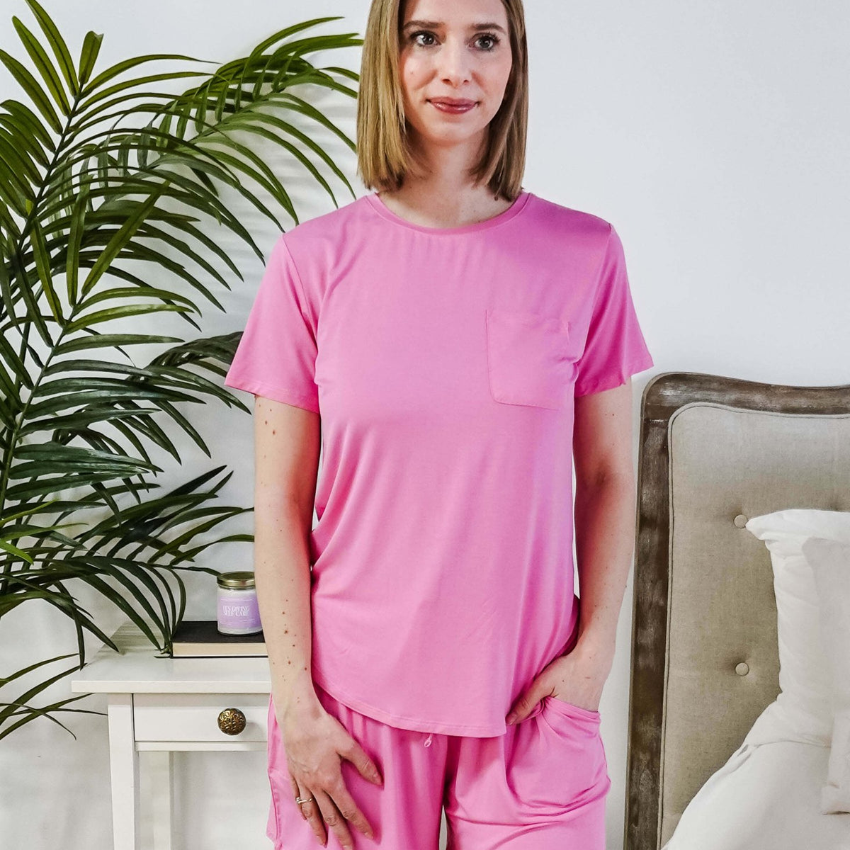 Model wearing a Bubblegum Pink Tee Short Bamboo Pajama Set, featuring a stylish pocket and comfortable fit.