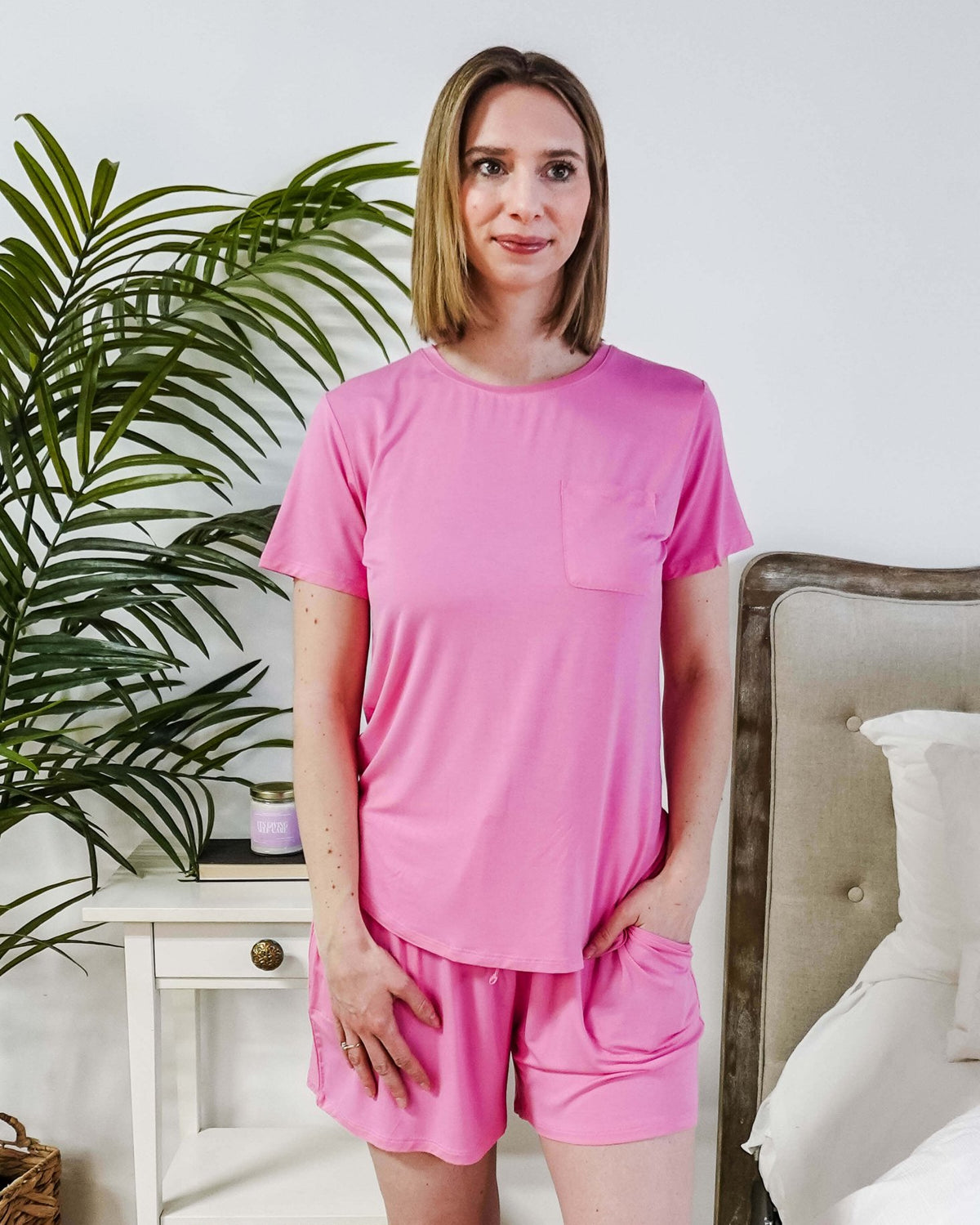 Model wearing a Bubblegum Pink Tee Short Bamboo Pajama Set, featuring a stylish pocket and comfortable fit.
