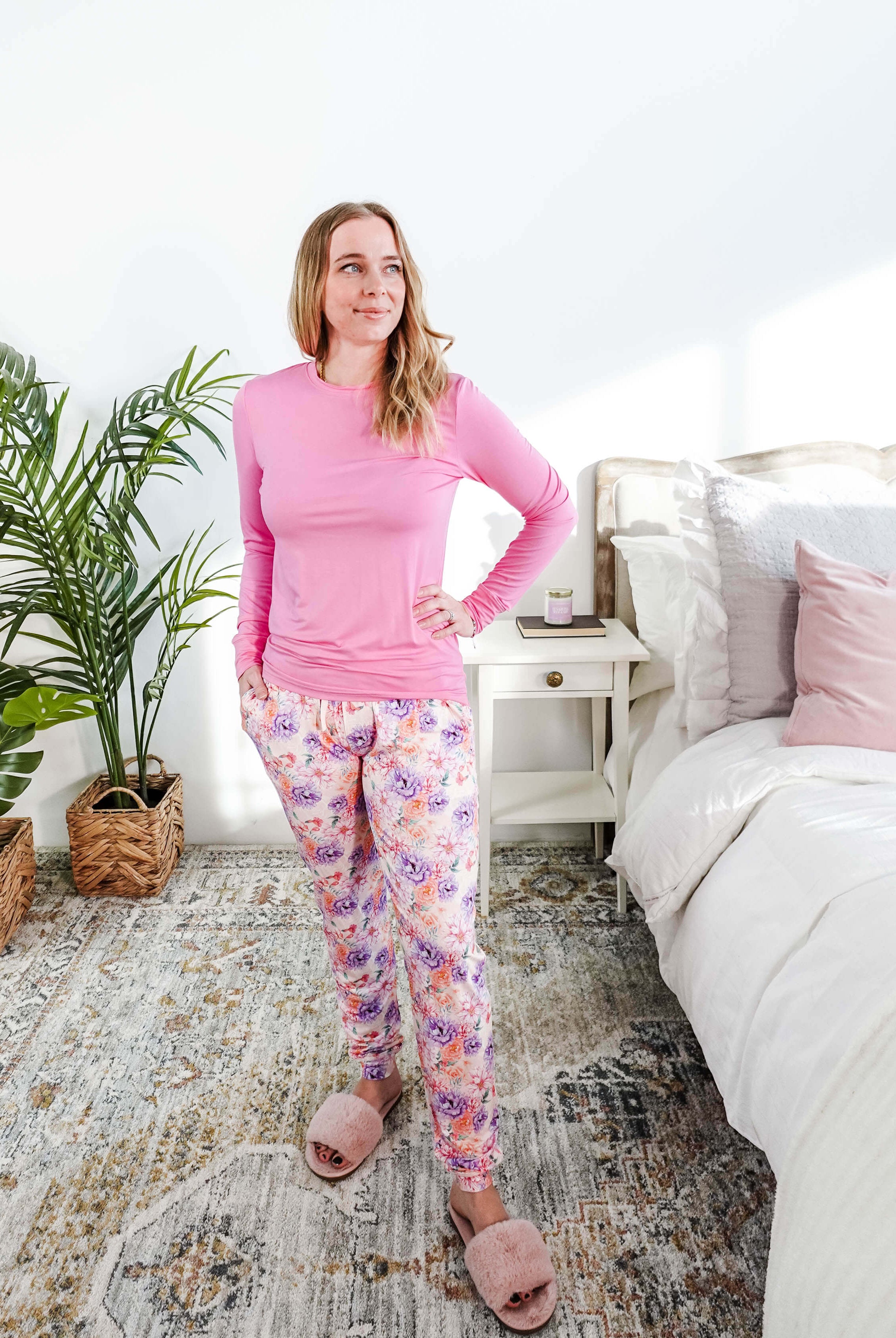 Woman wearing Dream In Blooms Long Sleeve Top & Jogger Bamboo Lounge Set in a cozy bedroom setting.