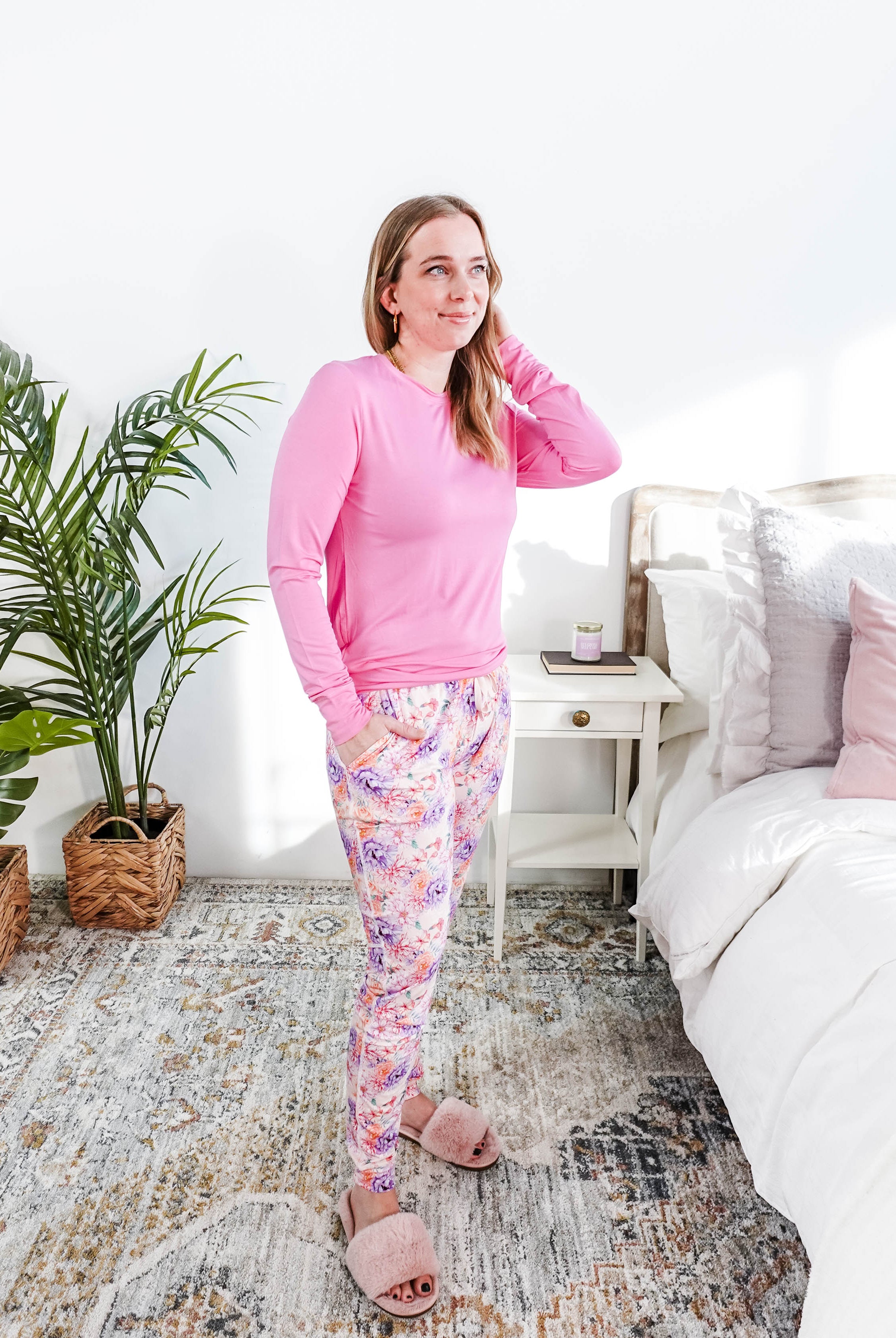 Woman wearing Dream In Blooms Long Sleeve Top & Jogger Bamboo Lounge Set in a cozy bedroom.