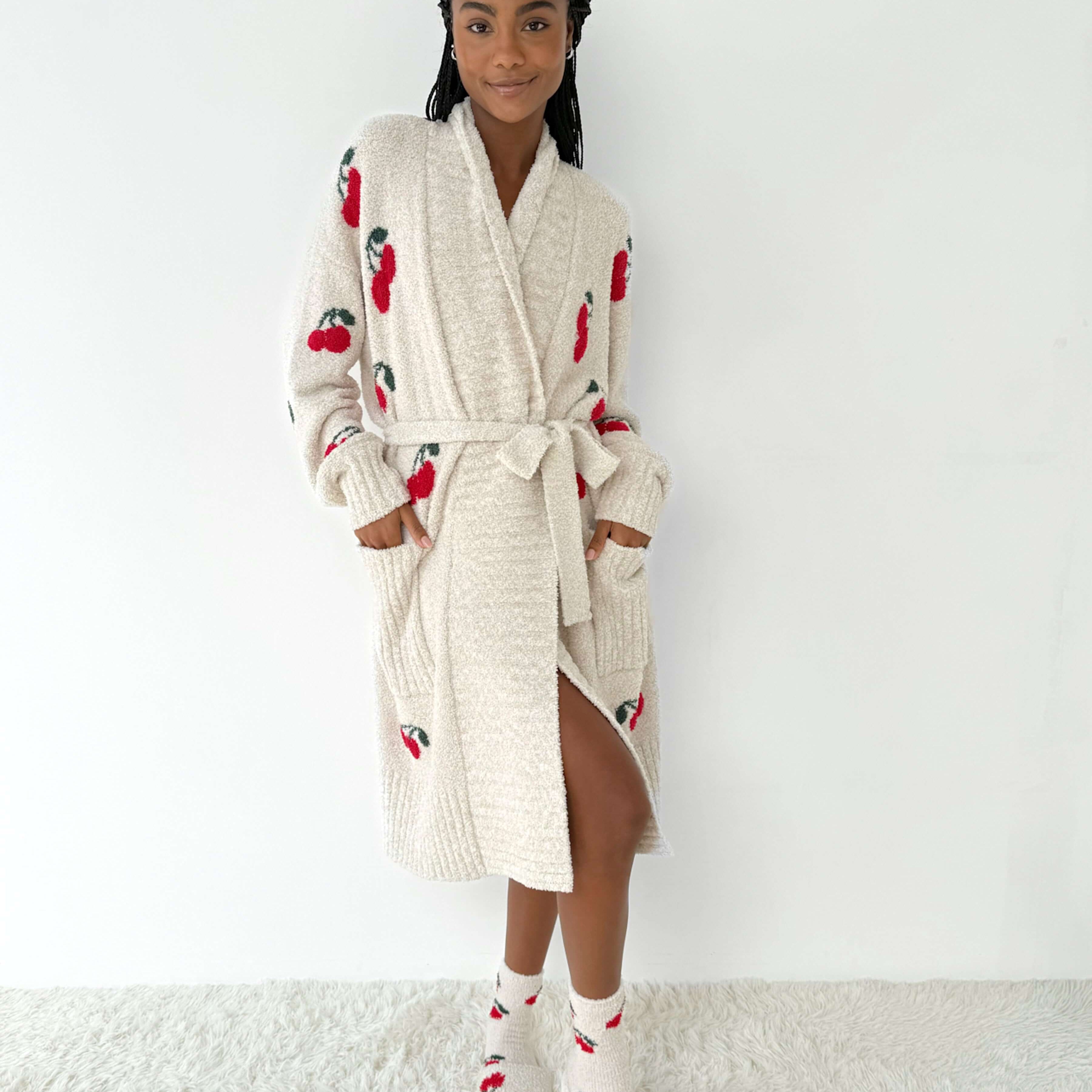 Model wearing the Pomona Fuzzy Yarn Robe Splendid, ultra-soft cozy loungewear with cherry patterns.