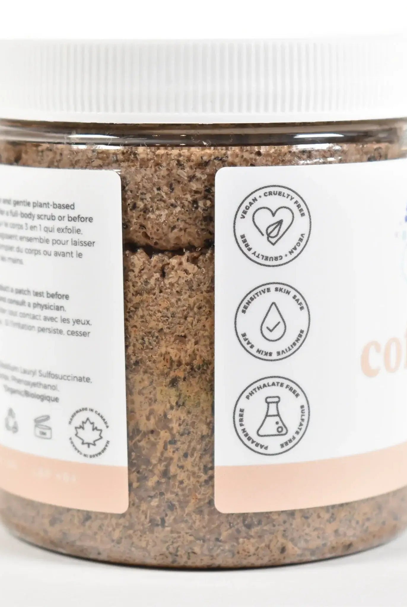 Coffee Bean Sugar Scrub jar with labels highlighting key ingredients and benefits.
