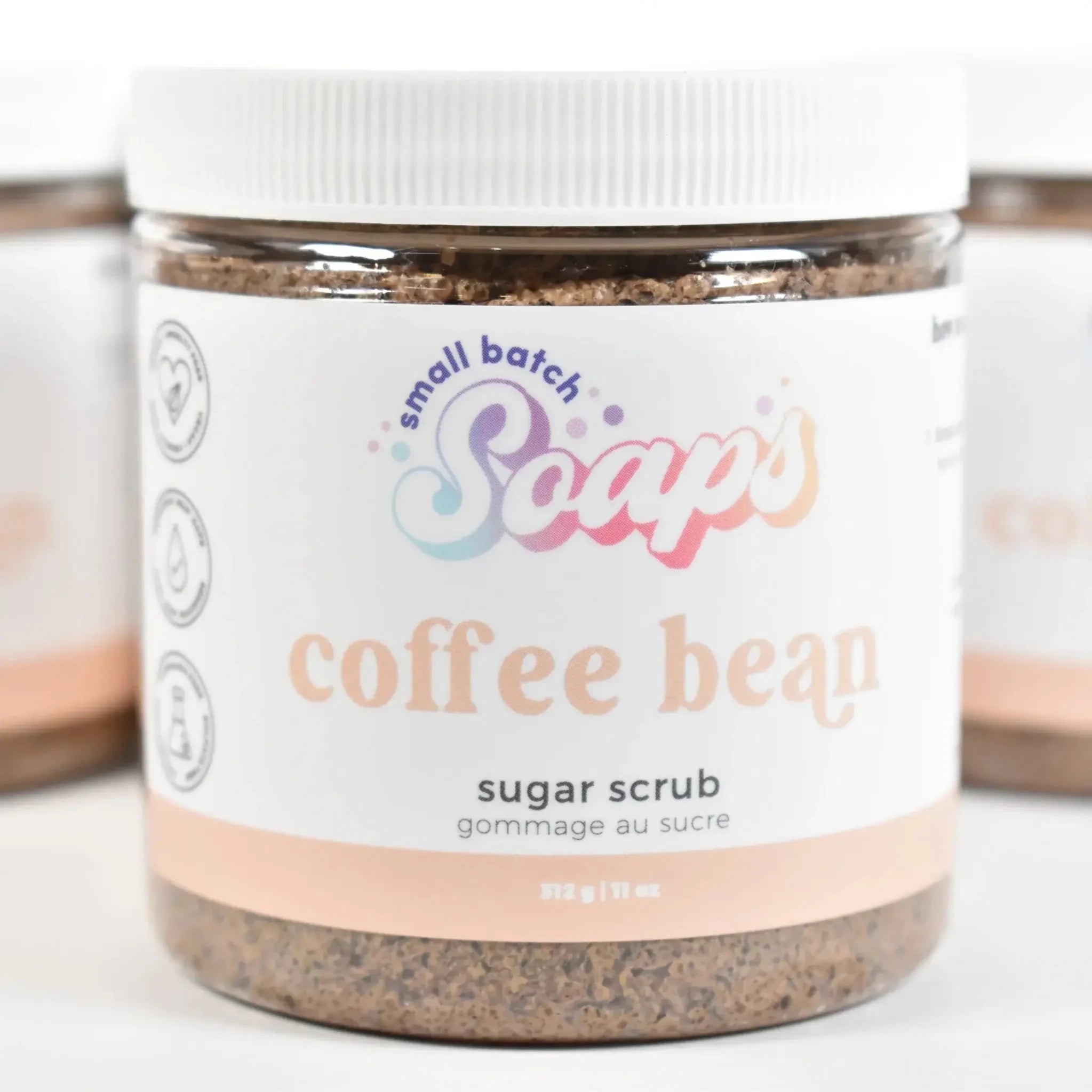 Coffee Bean Sugar Scrub in a clear jar, featuring small batch soaps branding and a brown sugar texture.