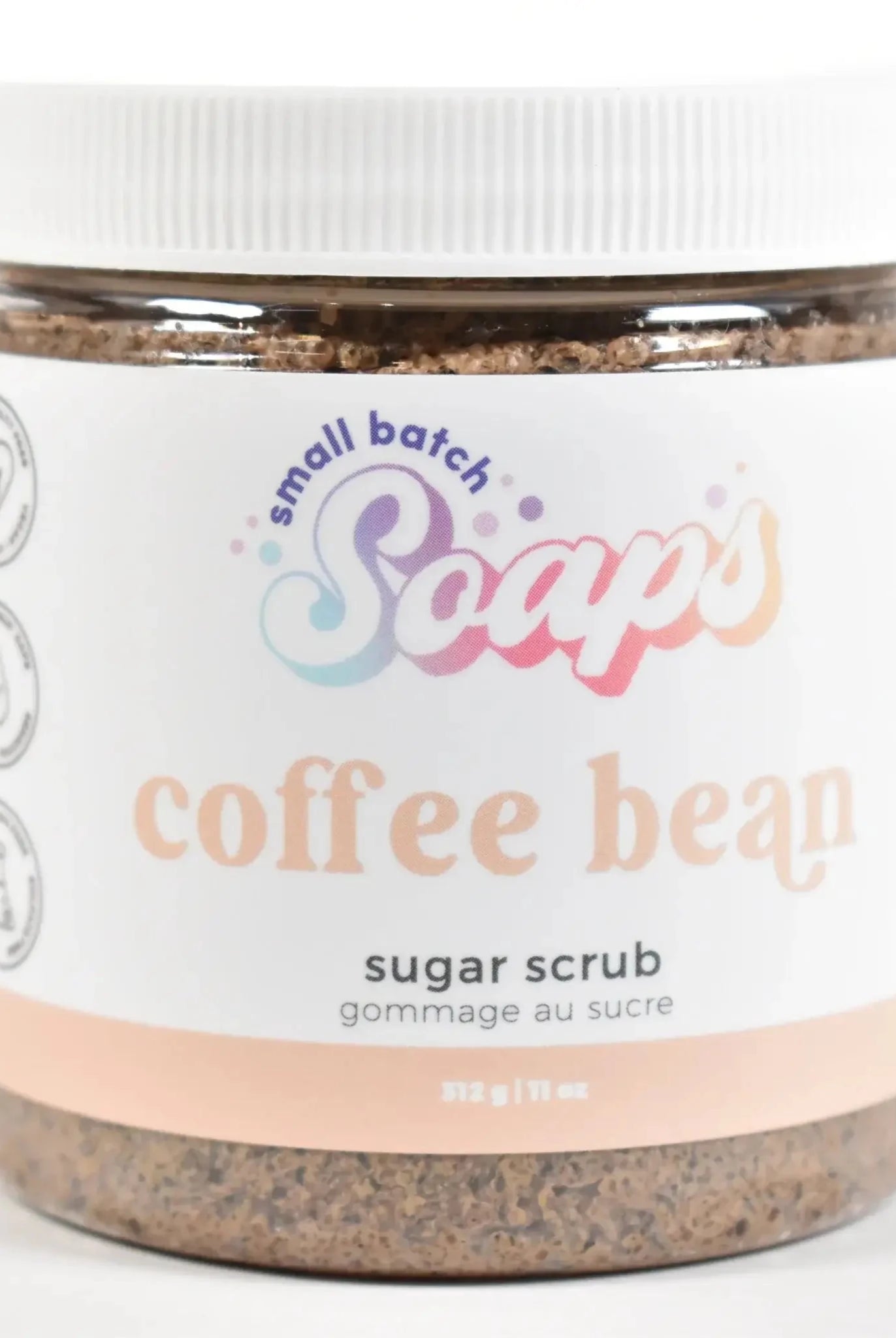 Coffee Bean Sugar Scrub in a clear jar, featuring small batch soaps branding and a brown sugar texture.