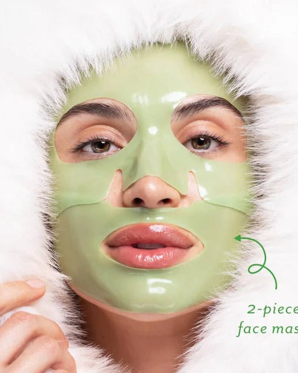 Person wearing a green face mask with a white fur-lined hood on a light background, Patchology Cool Crush cryo-inspired hydrogel face mask depuffing