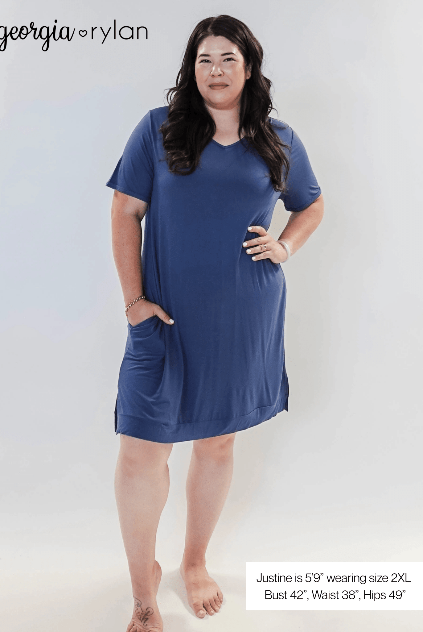 Stylish model wearing Denim Blue V Neck Bamboo Nightshirt dress with pockets, showcasing versatility in sleepwear and everyday fashion.